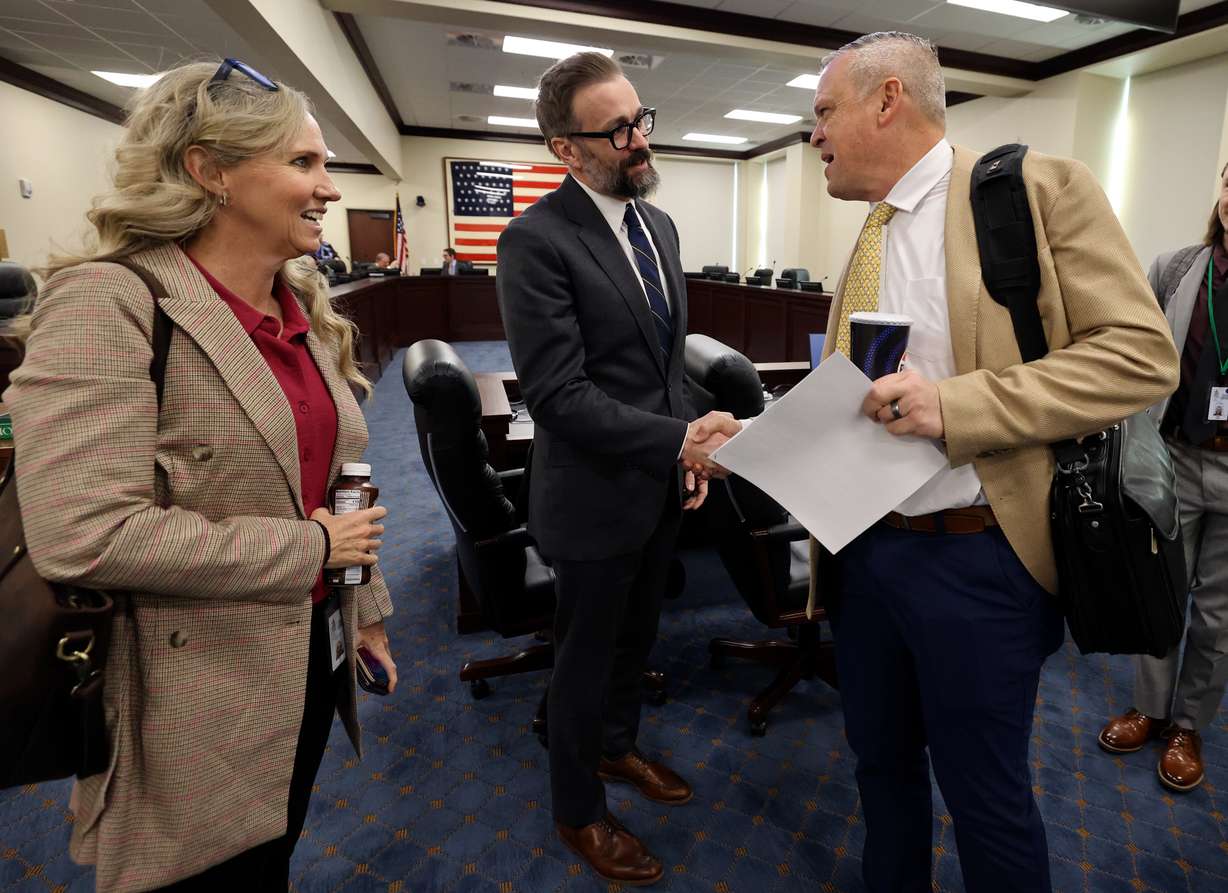 Utah System of Higher Education Commissioner Geoffrey Landward talks with Rep. Katy Hall, R-South Ogden, and Rep. Mark Strong, R-Bluffdale, after a meeting with the Higher Education Appropriations Subcommittee in the Senate Building in Salt Lake City on Jan. 23, 2025. The Utah Board of Higher Education debated nail technician programs as part of strategic reinvestment on Wednesday.