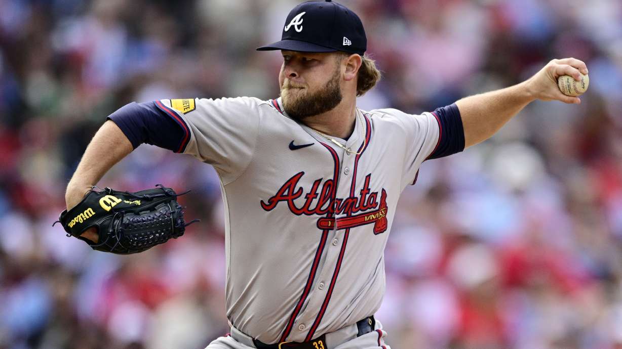 FILE - Atlanta Braves' A.J. Minter throws during a baseball game against the Philadelphia Phillies, Sunday, March 31, 2024, in Philadelphia.