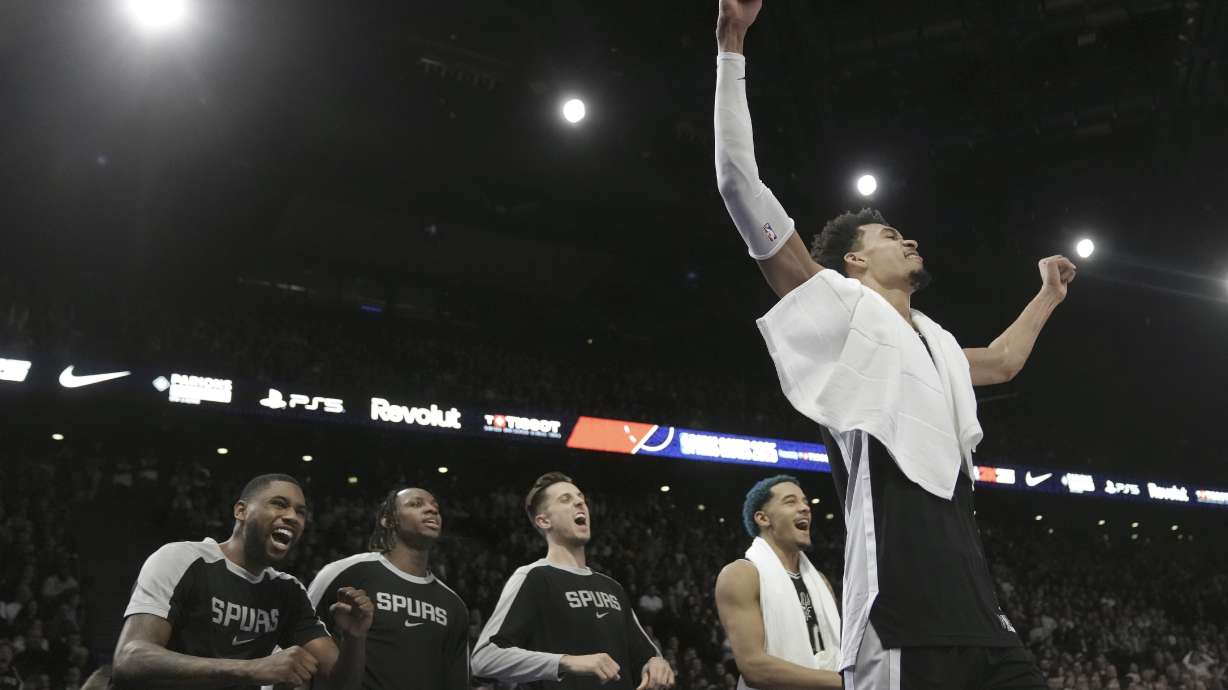 San Antonio Spurs center Victor Wembanyama, right, and teammates celebrate during the second half of a Paris Games 2025 NBA basketball game against the Indiana Pacers in Paris, Thursday, Jan. 23, 2025.