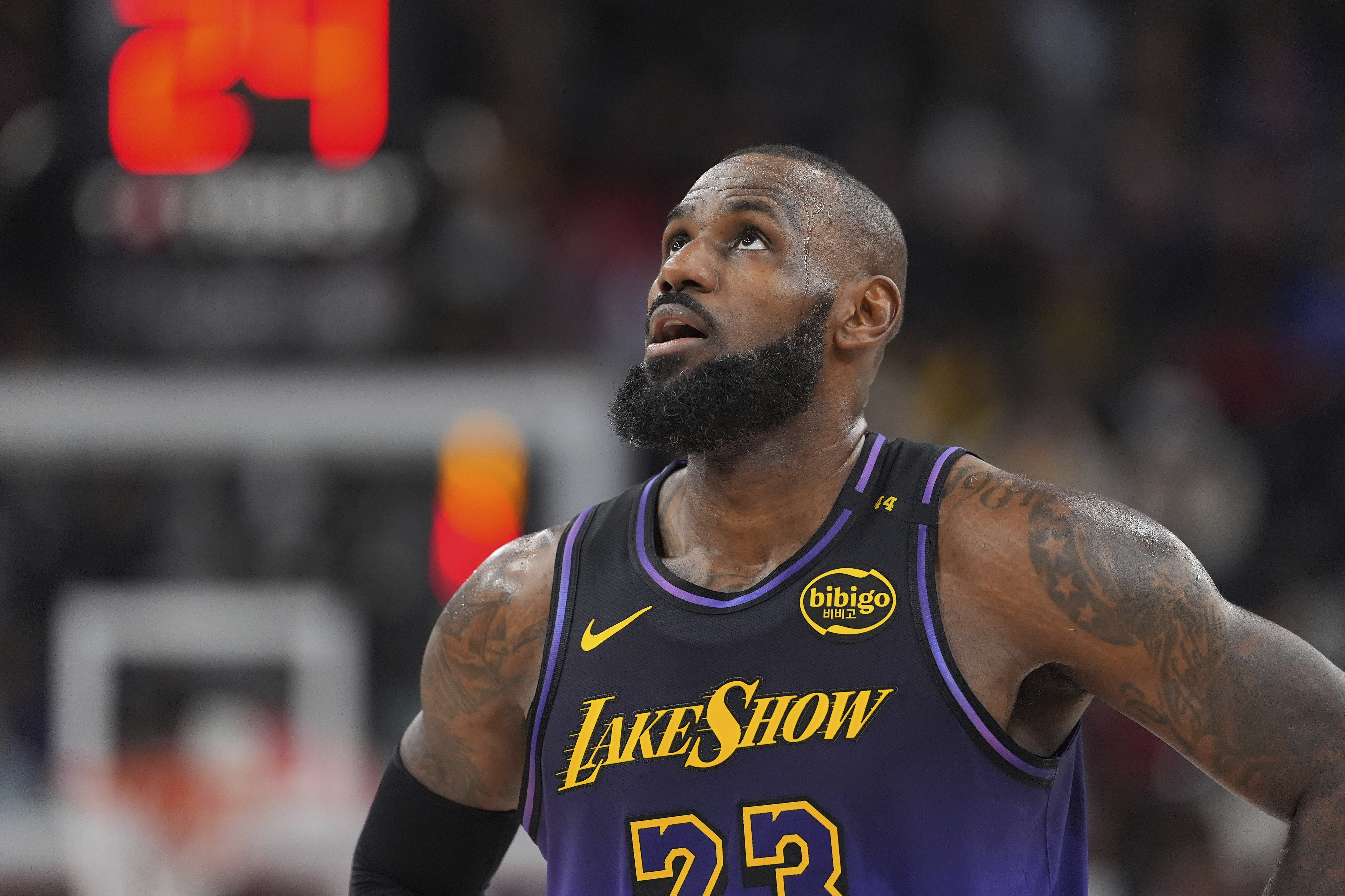 Los Angeles Lakers forward LeBron James looks toward the scoreboard during the second half of an NBA basketball game against the Los Angeles Clippers, Sunday, Jan. 19, 2025, in Inglewood, Calif.