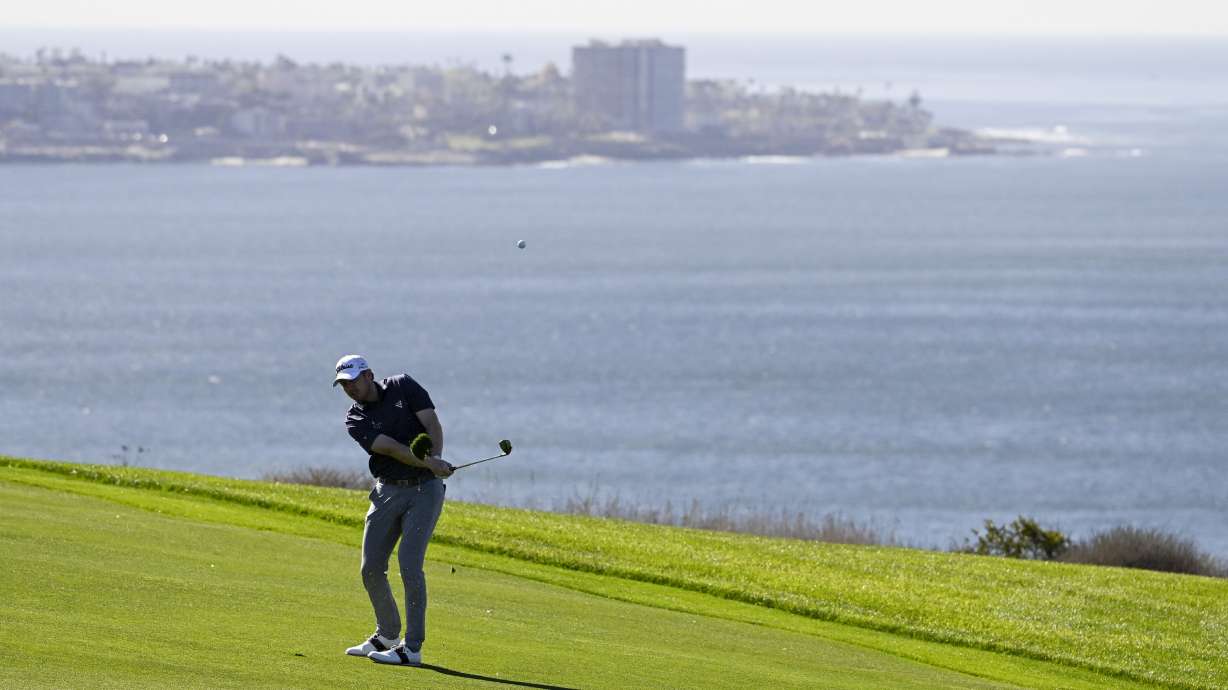 Hayden Springer hits his second shot on the fourth hole of the South Course at Torrey Pines during the second round of the Farmers Insurance Open golf tournament Thursday, Jan. 23, 2025, in San Diego.