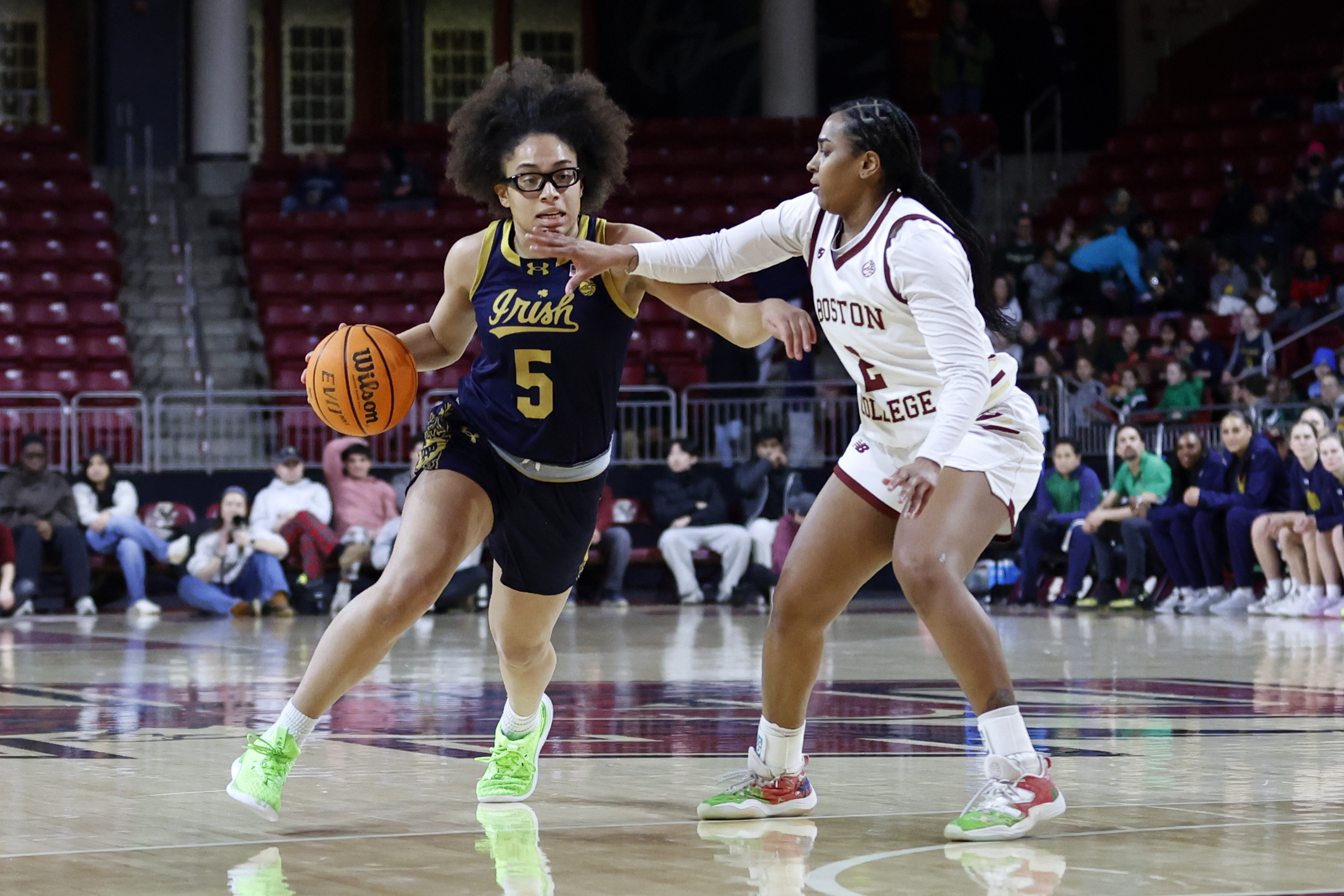 Notre Dame guard Olivia Miles (5) drives past Boston College guard Kaylah Ivey (2) during the first half of an NCAA college basketball game, Thursday, Jan. 23, 2025, in Boston. 