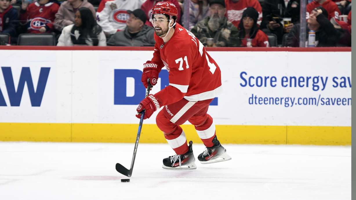 Detroit Red Wings center Dylan Larkin skates with the puck during the first period of an NHL hockey game against the Montreal Canadiens, Thursday, Jan. 23, 2025, in Detroit.