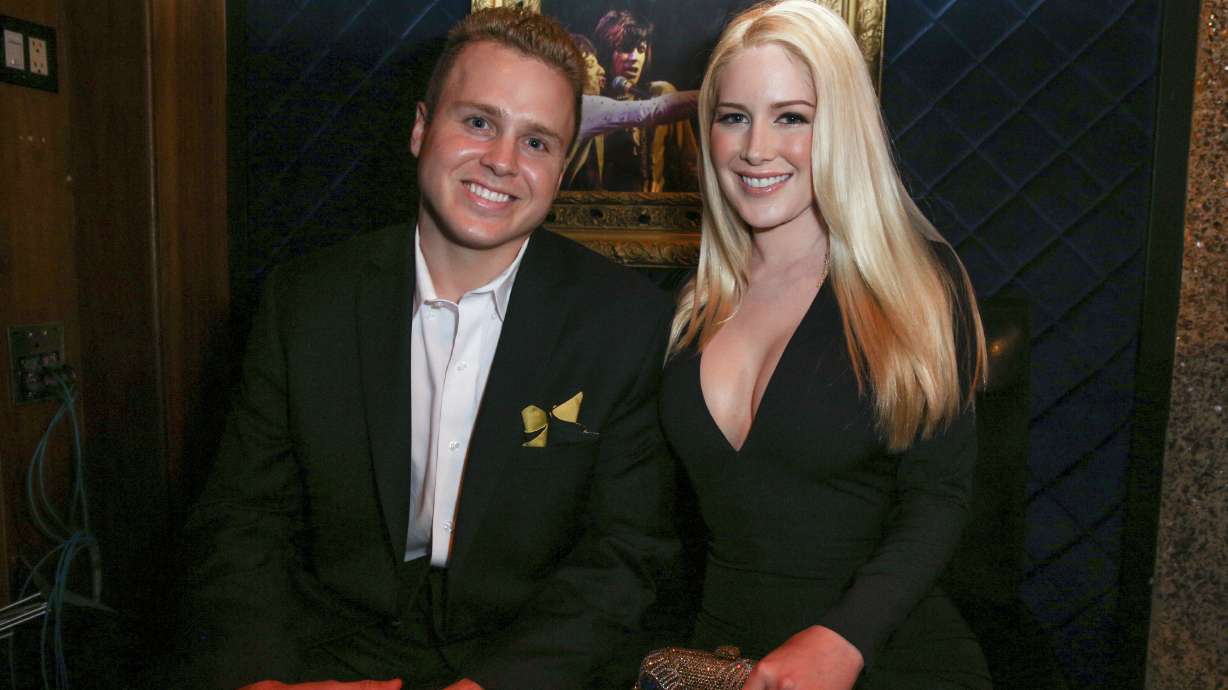 Spencer Pratt, left, and Heidi Montag pose backstage at the 3rd Annual Reality TV Awards at the Avalon Hollywood, May 13, 2015, in Los Angeles. The couple has sued LA after they lost their home in the fires.