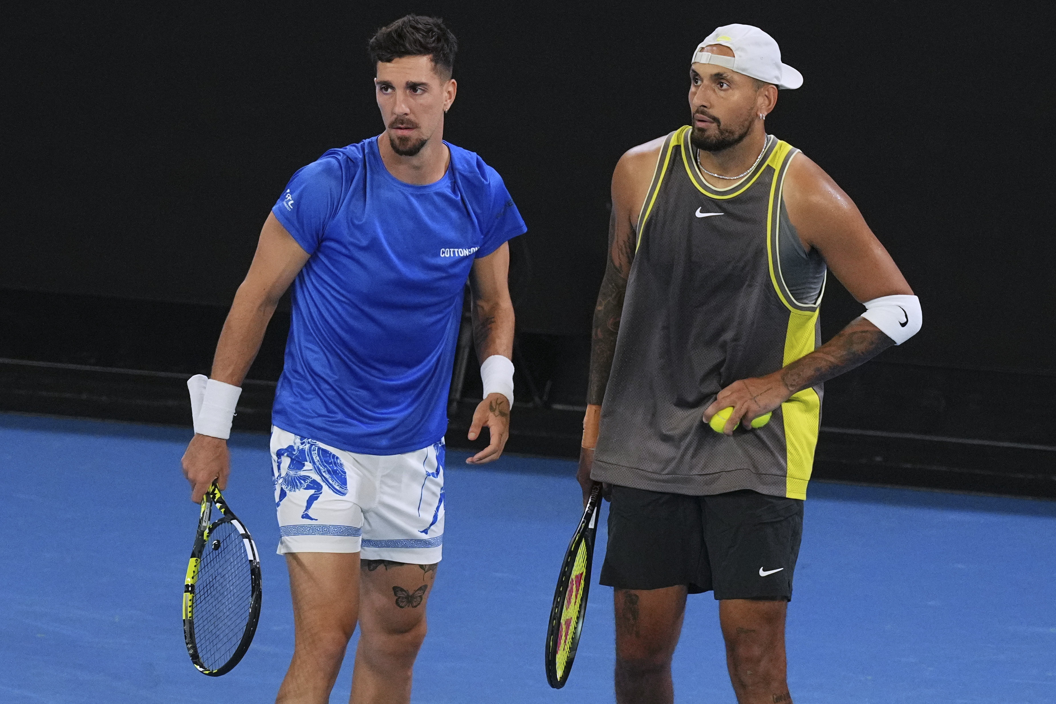 Australia's Nick Kyrgios, right, and Thanasi Kokkinakis in action during their first round doubles match against compatriots James Duckworth and Aleksandar Vukic at the Australian Open tennis championship in Melbourne, Australia, Thursday, Jan. 16, 2025.
