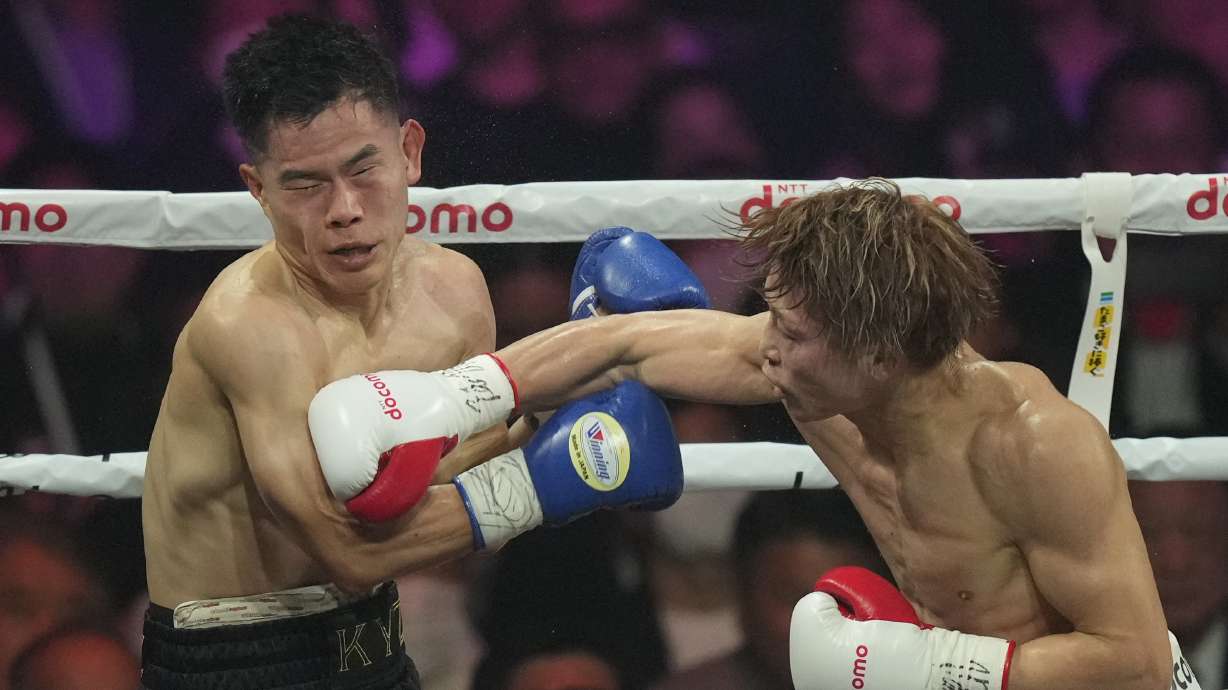 Japanese champion Naoya Inoue, right, punches South Korea challenger Ye Joon Kim during the unified WBC IBF and WBO super bantamweight world title at the Ariake Arena in Tokyo, Friday, Jan.24, 2025.