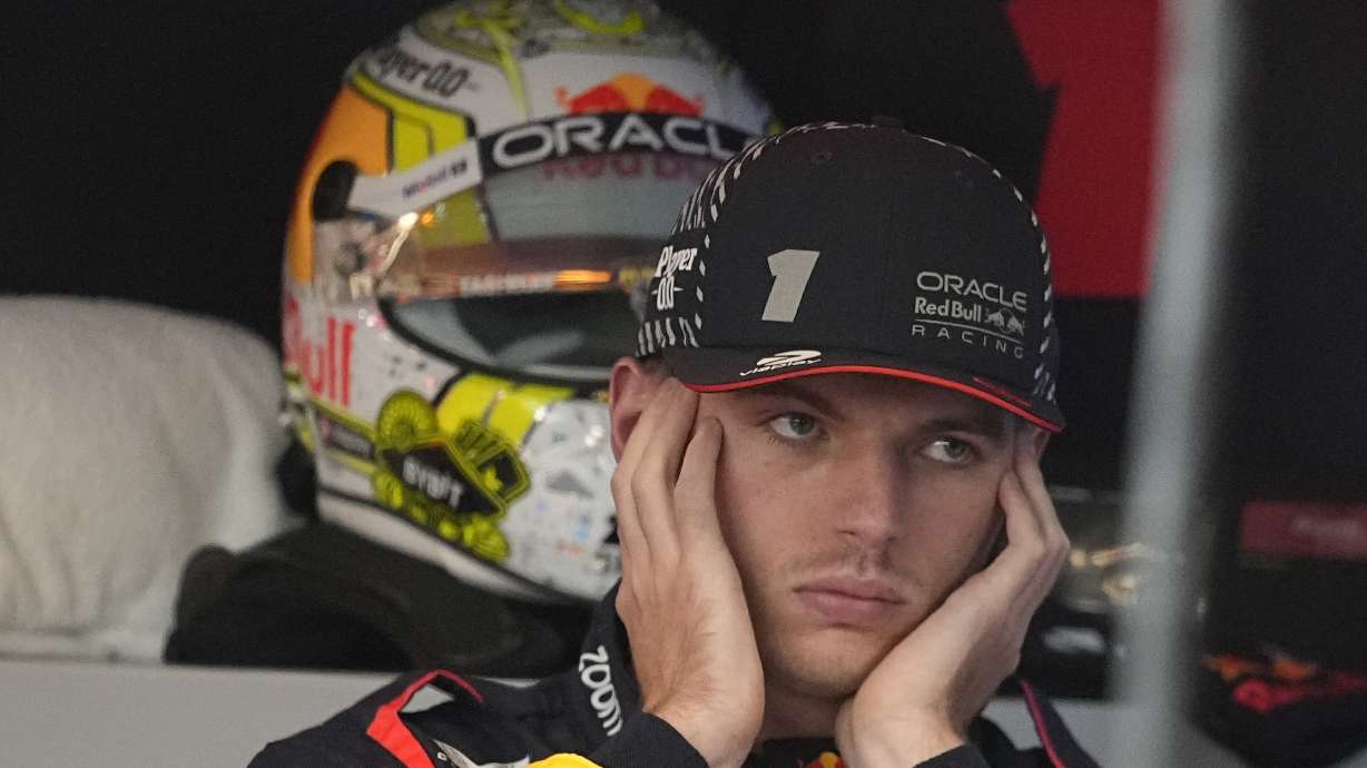 FILE - Red Bull driver Max Verstappen, of the Netherlands, covers his ears in the garage before the first practice session for the Formula One Las Vegas Grand Prix auto race, Thursday, Nov. 16, 2023, in Las Vegas.