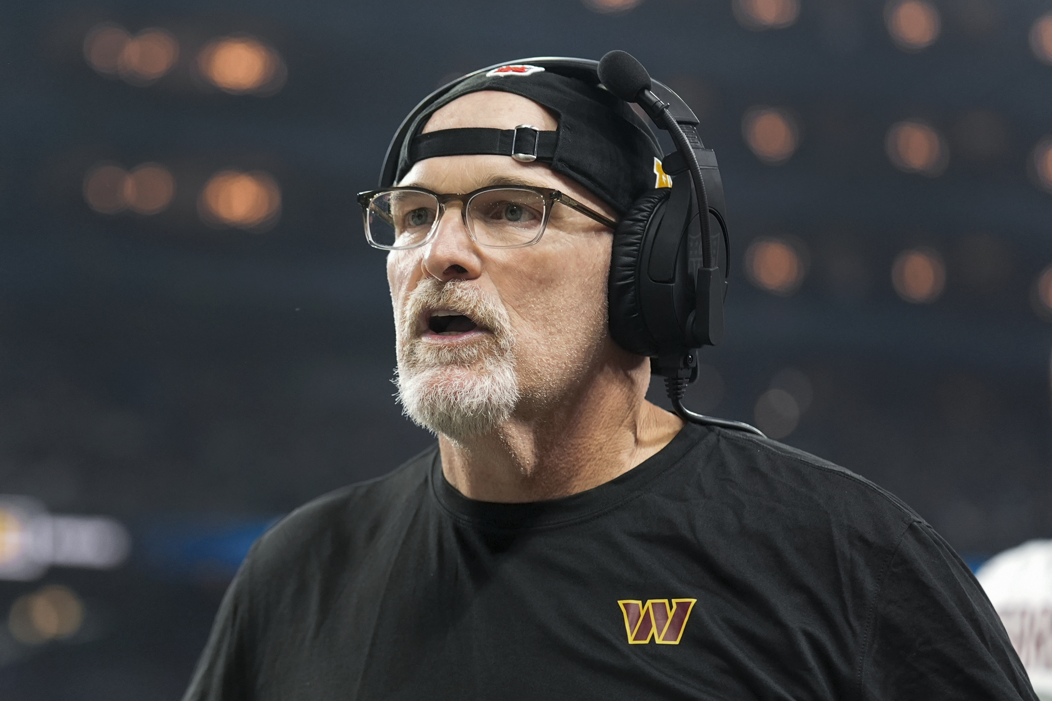 Washington Commanders head coach Dan Quinn watches against the Detroit Lions during the first half of an NFL football divisional playoff game, Saturday, Jan. 18, 2025, in Detroit.