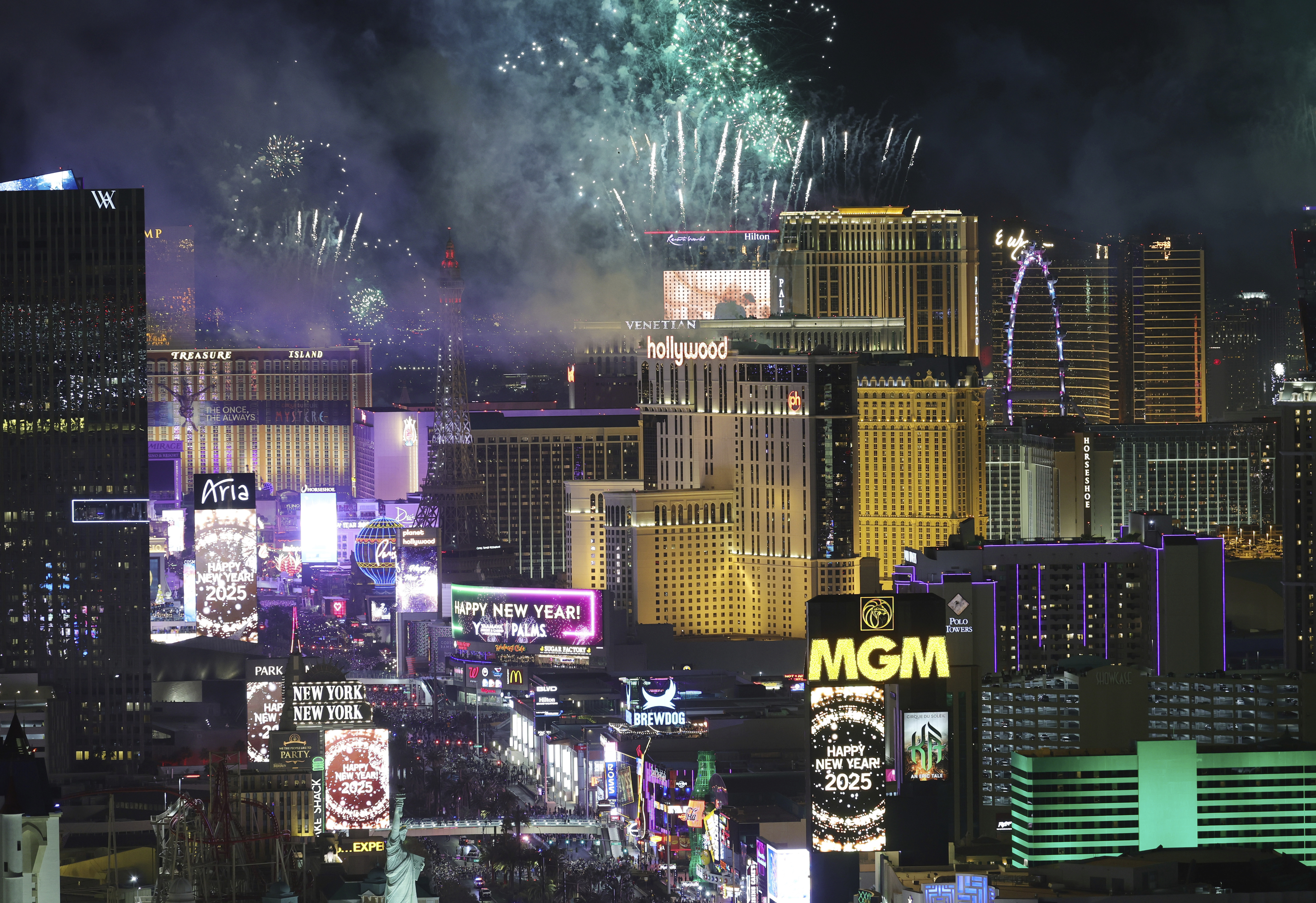 Fireworks celebrating the new year explode over Las Vegas Strip casinos just after midnight Wednesday, Jan. 1, 2025, in Las Vegas.