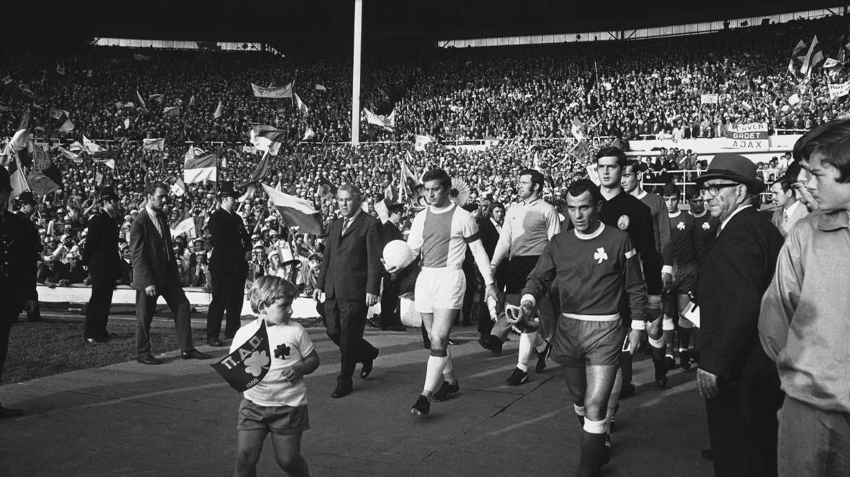 The captains lead out the two teams for the start of the Final of the European Soccer Champion Club's Cup between Panathinaikos of Greece and Ajax of Amsterdam, at Wembley Stadium, London, in June 2, 1971.