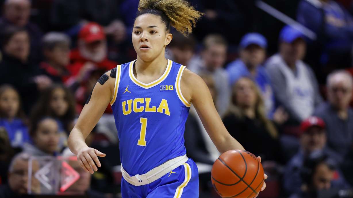 UCLA guard Kiki Rice dribbles against Rutgers during the first half of an NCAA college basketball game, Thursday, Jan. 23, 2025, in Piscataway, N.J.