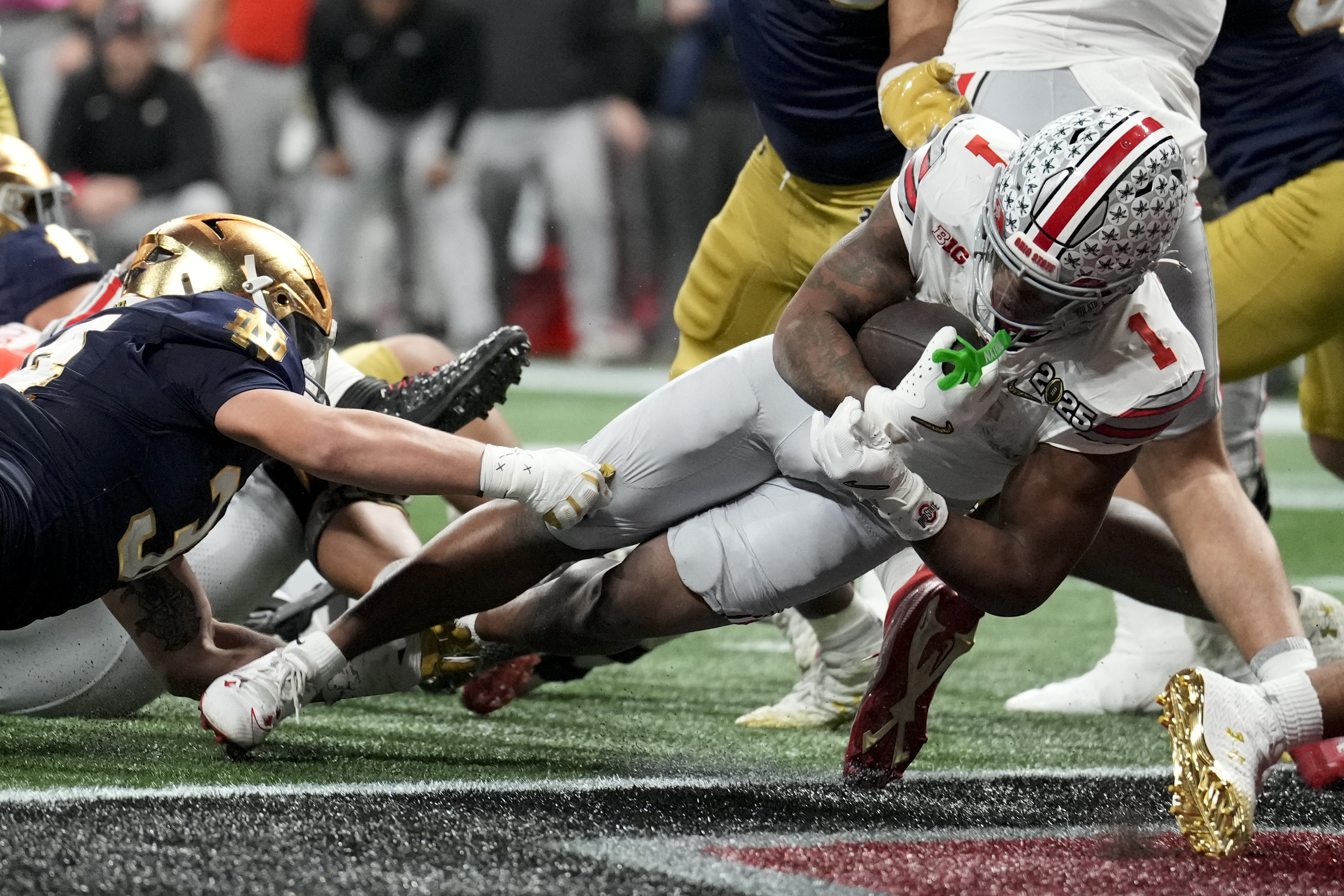 Ohio State running back Quinshon Judkins scores against Notre Dame during second half of the College Football Playoff national championship game Monday, Jan. 20, 2025, in Atlanta.