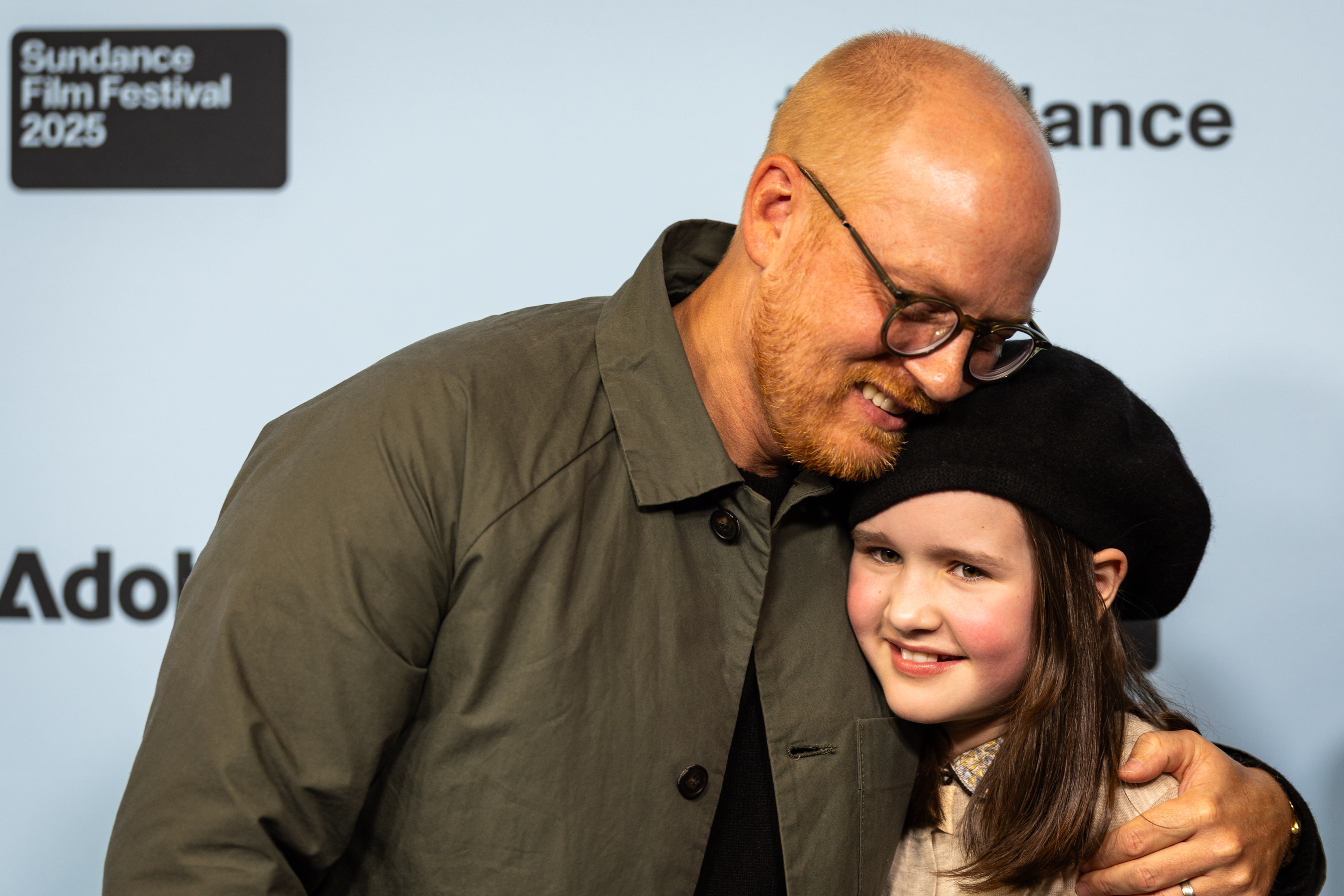 Cole Webley, left, hugs Molly Belle Wright at the premiere of “Omaha” during the Sundance Film Festival at The Ray Theatre in Park City on Thursday.