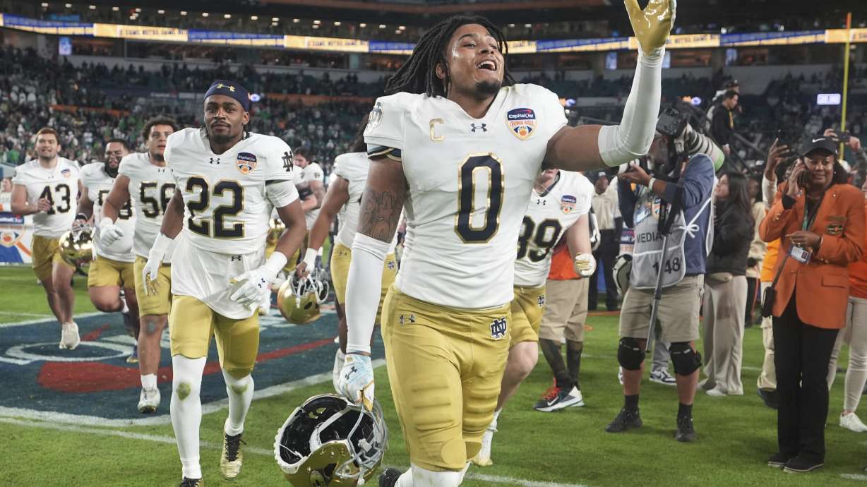 Notre Dame safety Xavier Watts (0) celebrates at the end of the Orange Bowl College Football Playoff semifinal game against Penn State, Thursday, Jan. 9, 2025, in Miami Gardens, Fla.