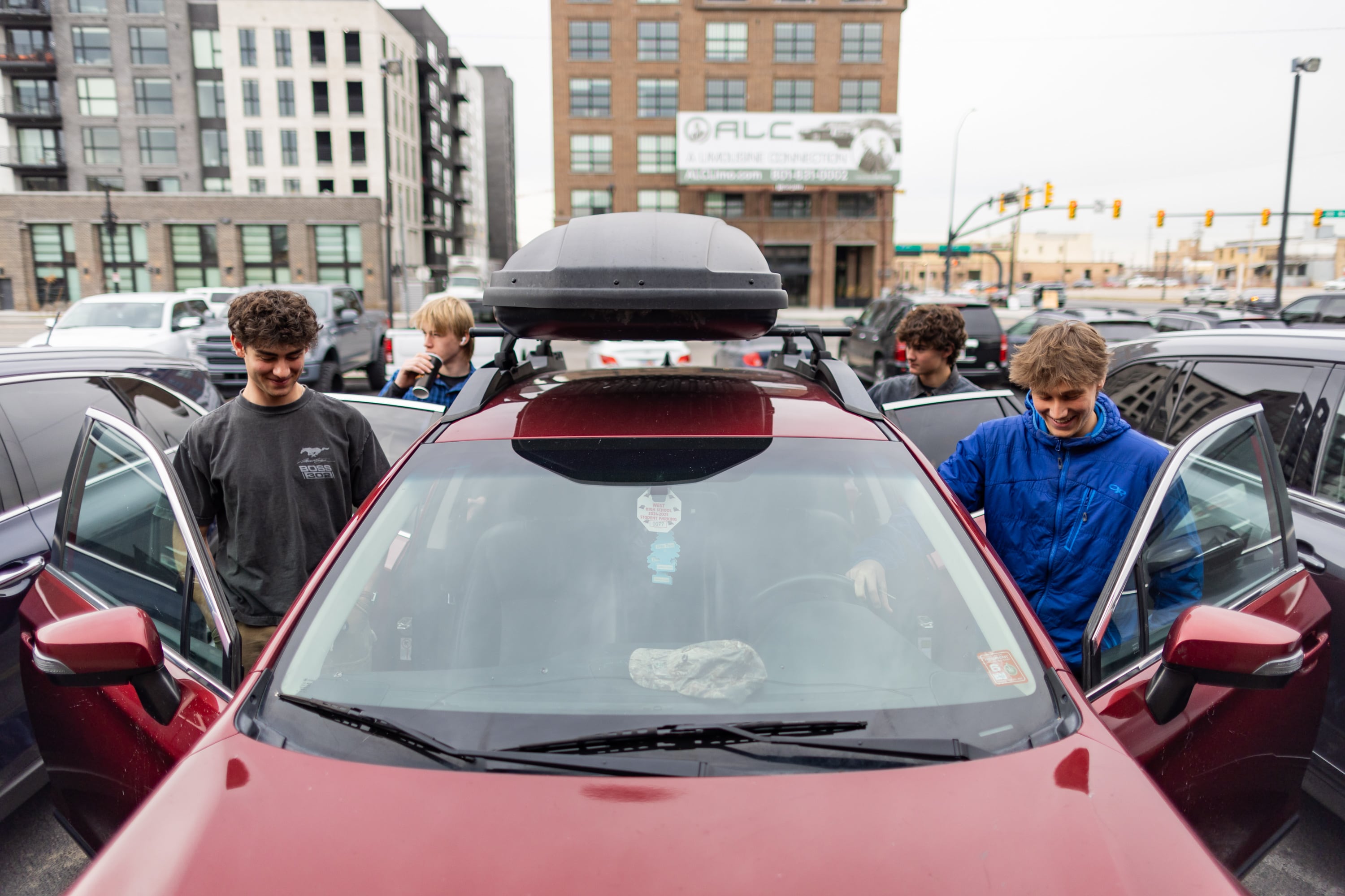 Charlie Livers, 18, left; Gus Pearson, 17, back left; Will Livers, 16, back right; and Billy Pollard, 17, right, leave lunch to drive back to West Senior High School in Salt Lake City on Friday. Lawmakers are considering easing driving restrictions for minors.