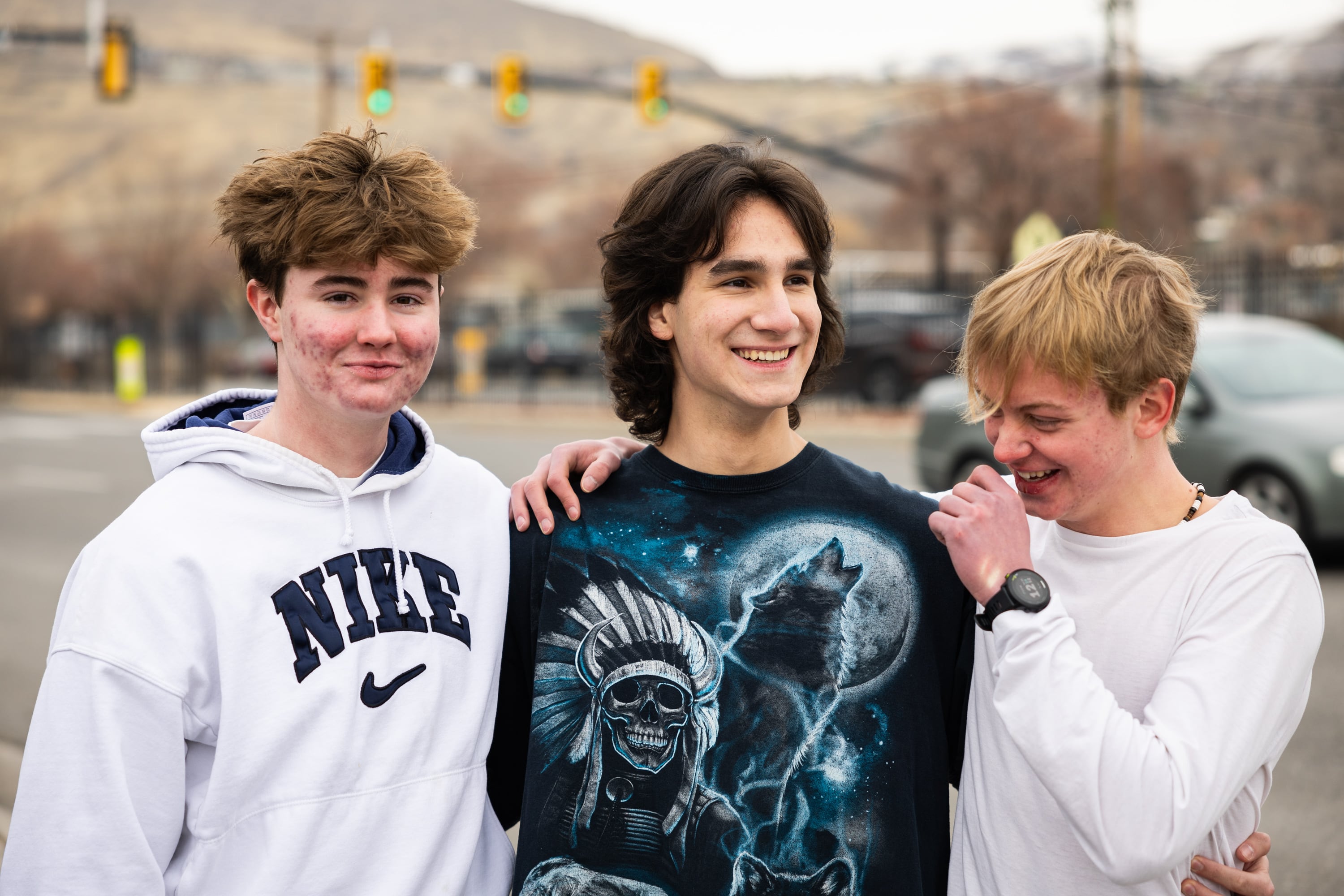 West High School students Tyler Bills, 16; Mateo Gargano, 17; and Samuel Andrews, 17, from left to right, pose in the parking lot at West High School in Salt Lake City on Friday.