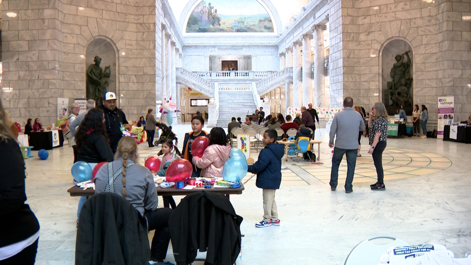 Child care advocates hosted a rally inside the Capitol Rotunda in Salt Lake City on Friday.