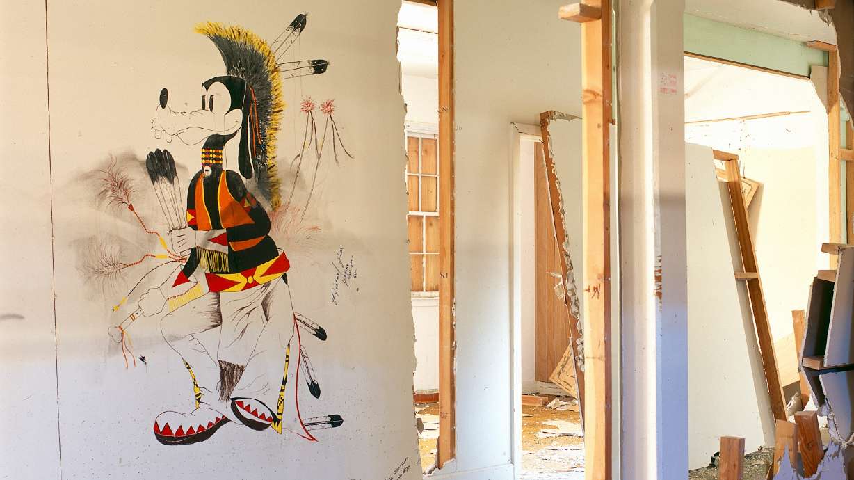 The photo show a mural by Michael Polk that's part of an exhibit of murals from the old Intermountain Intertribal Indian School that went on display Friday at Utah State University.