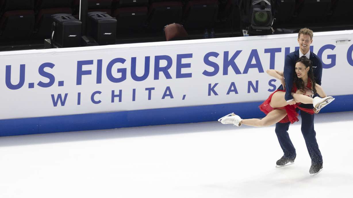 Madison Chock, front, and Evan Bates, back, perform during the ice dance rhythm dance competition at the U.S. figure skating championships Friday, Jan. 24, 2025, in Wichita, Kan.