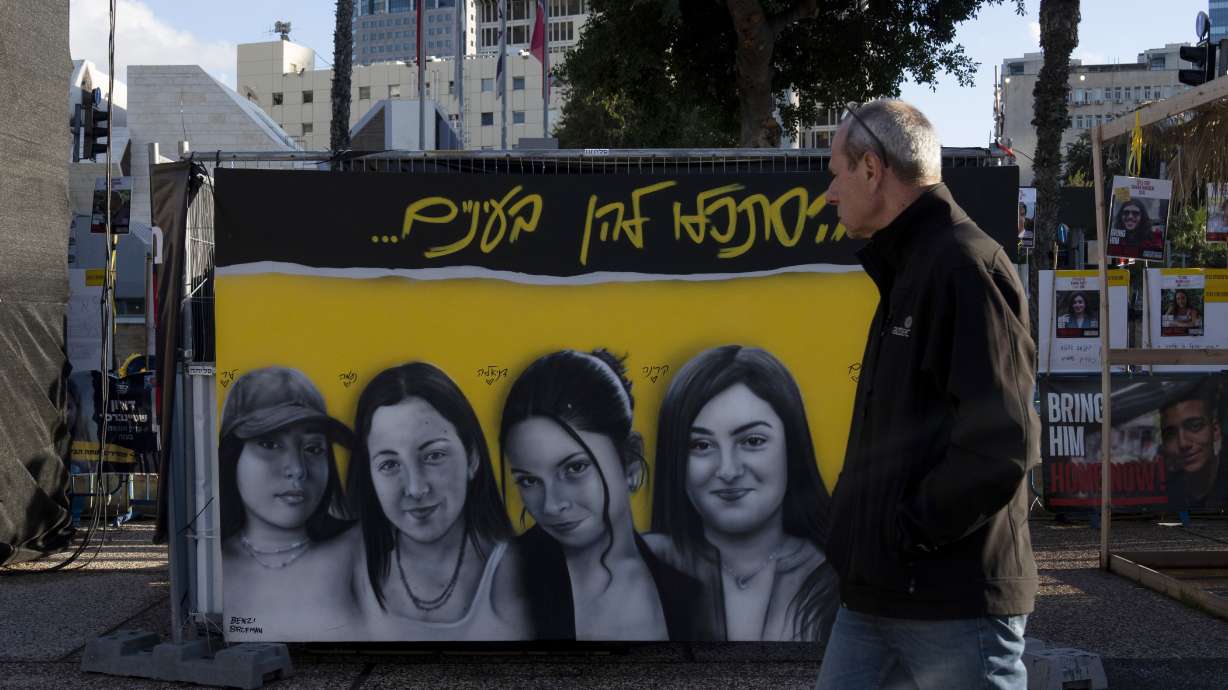 A mural of female Israeli soldiers held hostage by the Hamas militant group in the Gaza Strip is displayed in Tel Aviv, Israel, Friday.