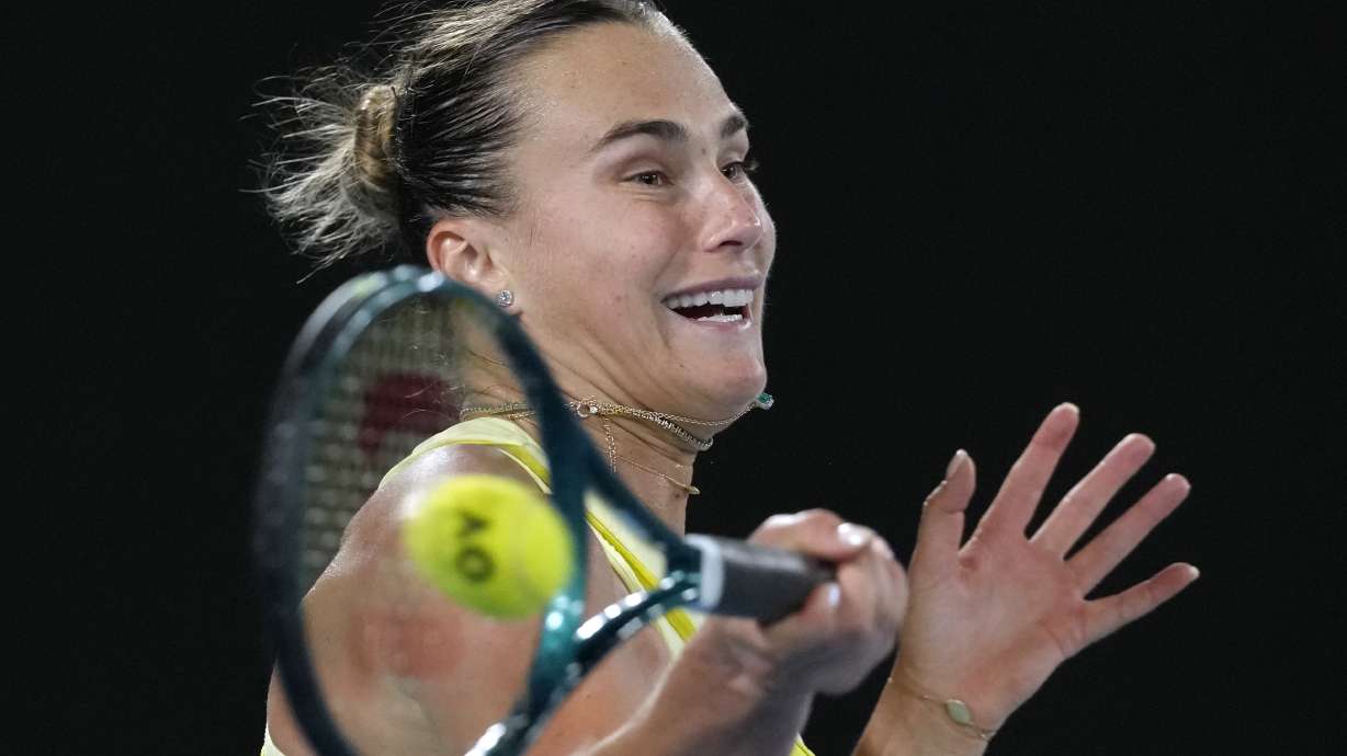 Aryna Sabalenka of Belarus plays a forehand return to Paula Badosa of Spain during their semifinal match at the Australian Open tennis championship in Melbourne, Australia, Thursday, Jan. 23, 2025.