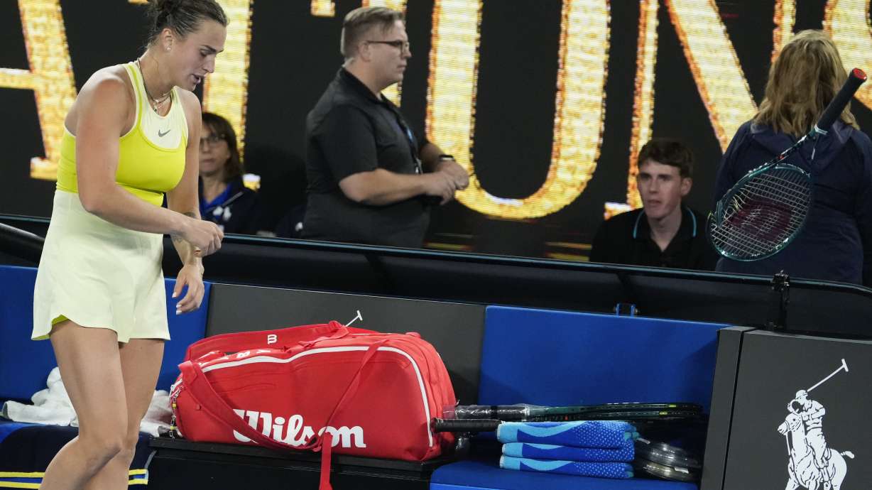 Aryna Sabalenka of Belarus throws her racker after losing the women's singles final against Madison Keys of the U.S. at the Australian Open tennis championship in Melbourne, Australia, Saturday, Jan. 25, 2025.