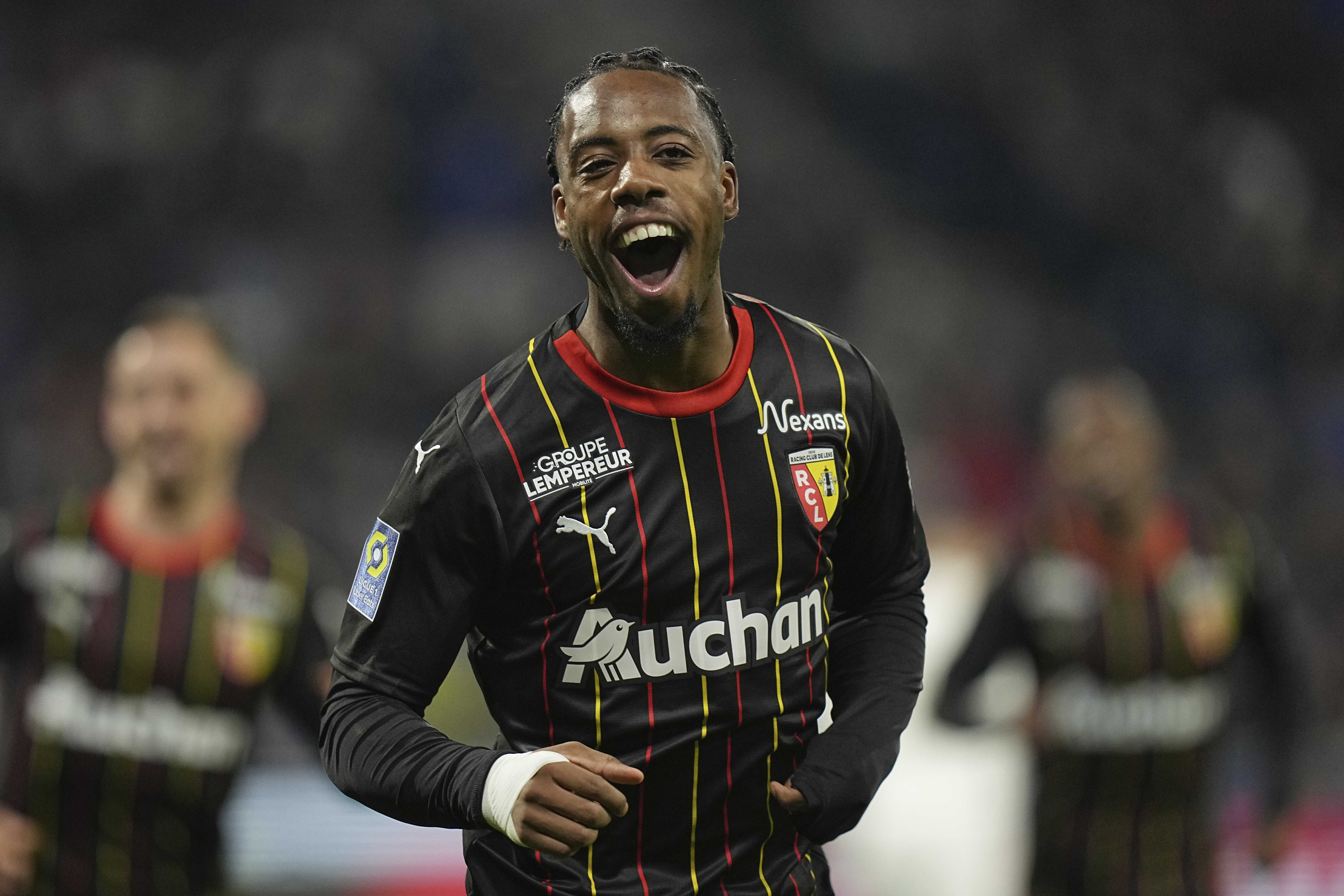 FILE - Lens' Elye Wahi celebrates after scoring his side' second goal during the French League One soccer match between Lyon and Lens at the Groupama stadium, outside Lyon, France, Sunday, March 3, 2024.