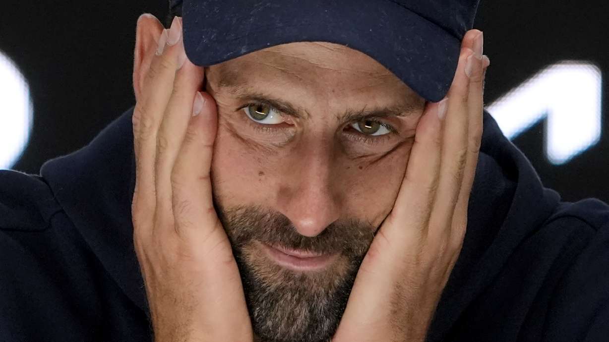 Novak Djokovic of Serbia reacts at a press conference after retiring in his semifinal match against Alexander Zverev of Germany at the Australian Open tennis championship in Melbourne, Australia, Friday, Jan. 24, 2025.
