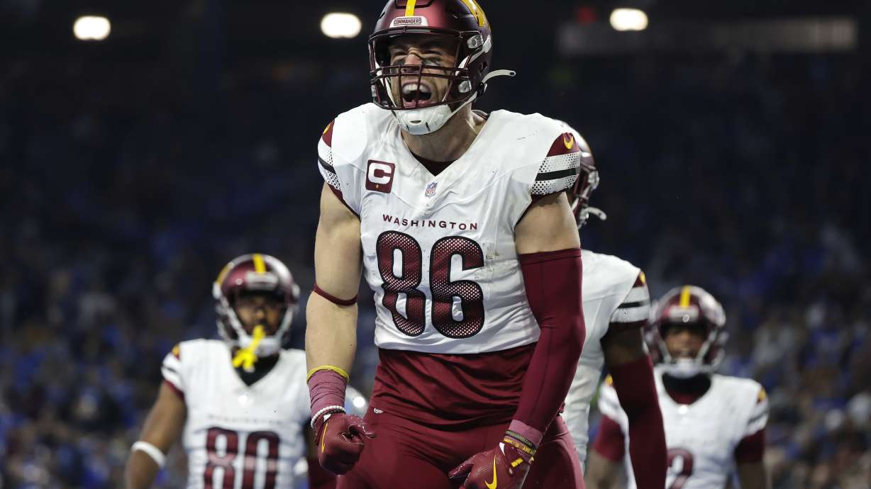 Washington Commanders tight end Zach Ertz (86) celebrates his five-yard touchdown reception against the Detroit Lions during the first half of an NFL football divisional playoff game, Saturday, Jan. 18, 2025, in Detroit.