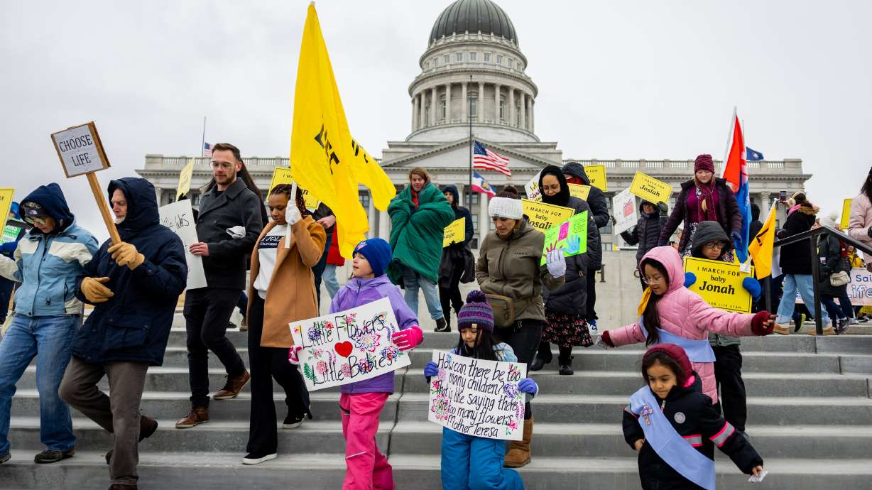 People walk in the Utah March for Life 2025 at the Utah Capitol in Salt Lake City on Saturday.