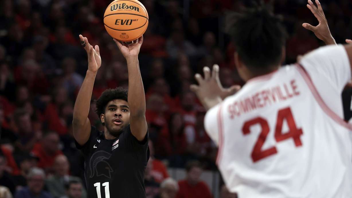 Michigan State guard Jase Richardson (11) shoots in front of Rutgers center Lathan Sommerville during the second half of an NCAA college basketball game Saturday, Jan. 25, 2025, in New York.