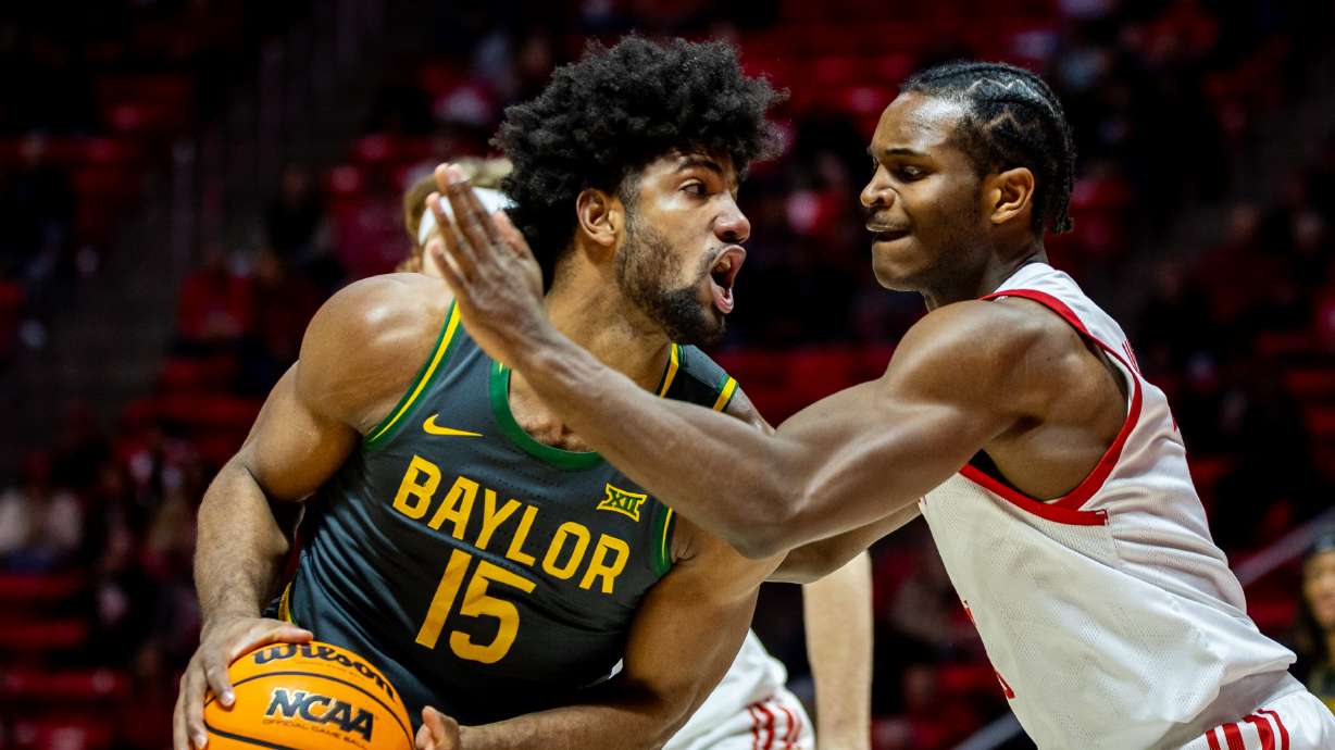 Utah Utes forward Ezra Ausar (2) guards Baylor Bears forward Norchad Omier (15) during a basketball game at the Jon M. Huntsman Center at the University of Utah in Salt Lake City on Saturday, Jan. 25, 2025.