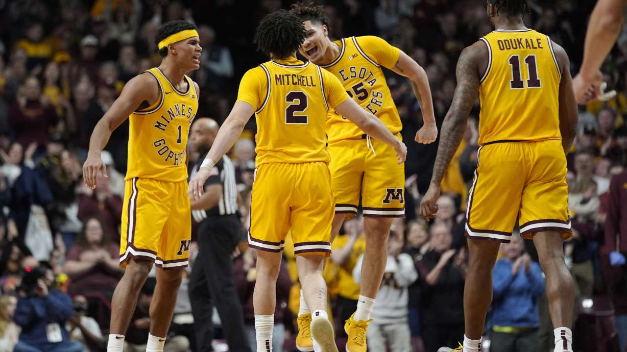 Minnesota guards Isaac Asuma (1), Mike Mitchell Jr. (2), Lu'Cye Patterson, third from left, and Femi Odukale (11) celebrate during the final seconds of an NCAA college basketball game against Oregon, Saturday, Jan. 25, 2025, in Minneapolis.