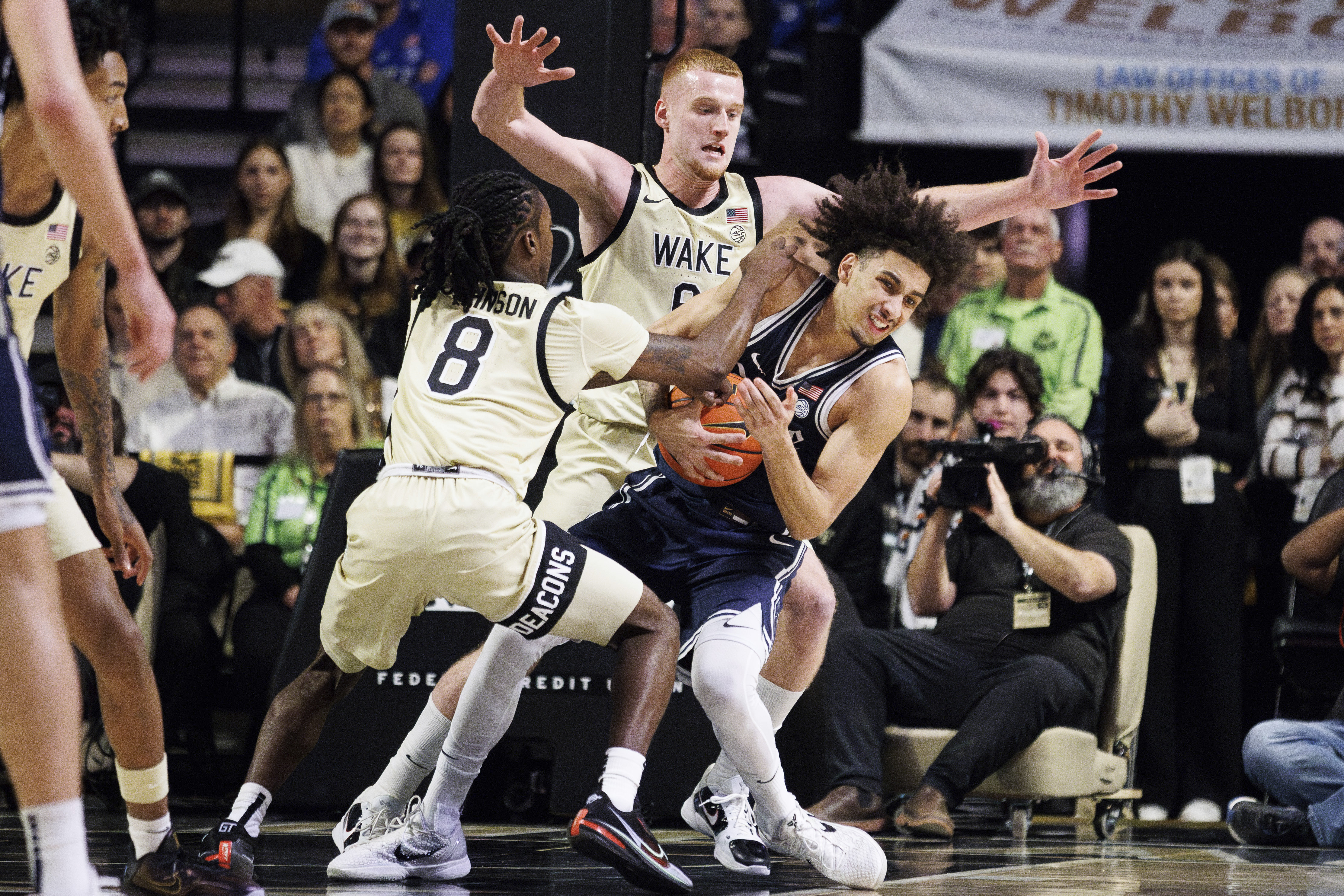 Duke's Tyrese Proctor, right, battles Wake Forest's Ty-Laur Johnson (8) and Cameron Hildreth for a ball during the first half of an NCAA college basketball game in Winston-Salem, N.C., Saturday, Jan. 25, 2025.