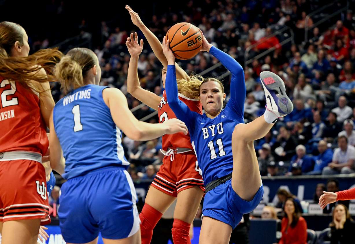 BYU guard Delaney Gibb (11) battles for a rebound with Utah guard Ines Vieira (2) behind her as BYU and Utah women play at the Marriott Center in Provo on Saturday, January 25, 2025.
