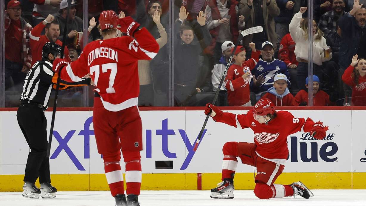 Detroit Red Wings center Marco Kasper (92) celebrates his goal against the Tampa Bay Lightning with defenseman Simon Edvinsson (77) during the second period of an NHL hockey game Saturday, Jan. 25, 2025, in Detroit.
