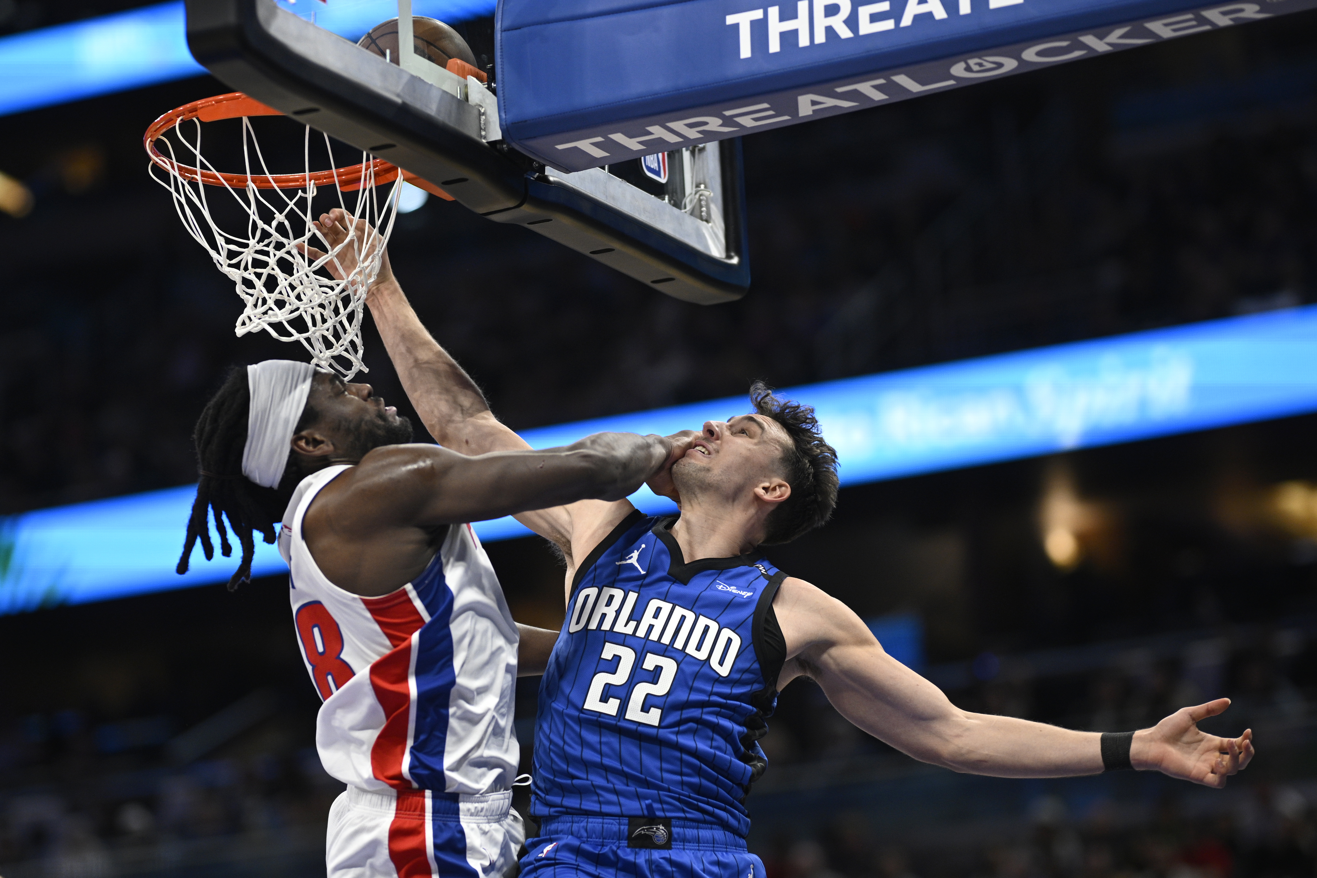 Orlando Magic forward Franz Wagner (22) is fouled by Detroit Pistons center Isaiah Stewart, left, while going up to dunk during the first half of an NBA basketball game, Saturday, Jan. 25, 2025, in Orlando, Fla.