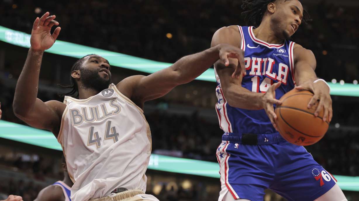 Philadelphia 76ers guard Ricky Council IV, right, grabs a rebound against Chicago Bulls forward Patrick Williams (44) during the first half of an NBA basketball game Saturday, Jan. 25, 2025, in Chicago.