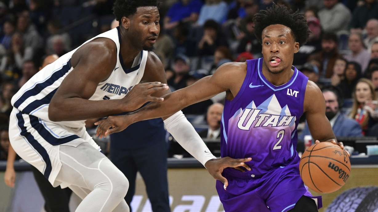 Utah Jazz guard Collin Sexton (2) handles the ball against Memphis Grizzlies forward Jaren Jackson Jr. in the first half of an NBA basketball game, Saturday, Jan. 25, 2025, in Memphis, Tenn.