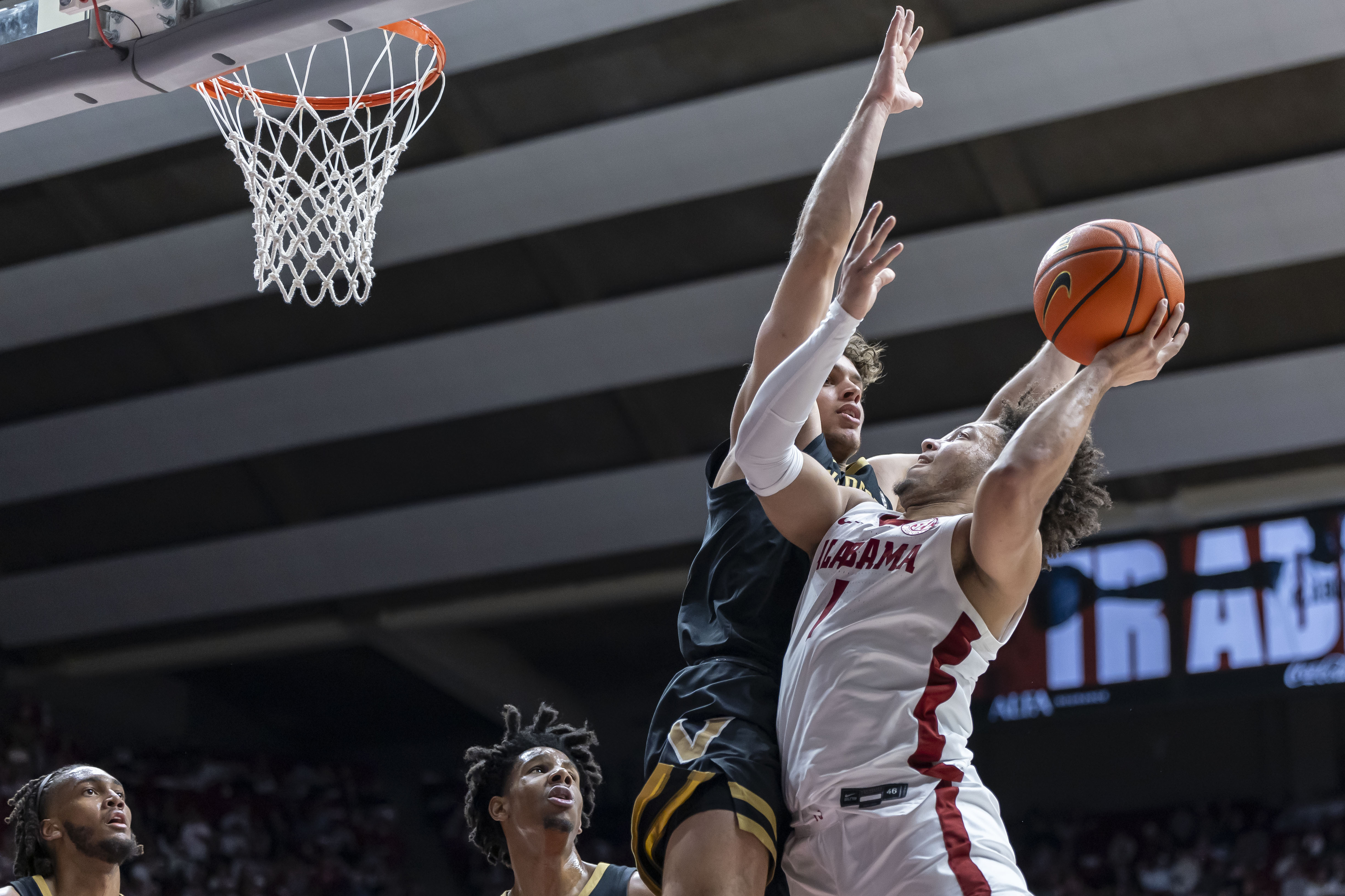 Alabama guard Mark Sears (1) works against Vanderbilt guard Chris MaƱon, left, during the second half of an NCAA college basketball game, Tuesday, Jan. 21, 2025, in Tuscaloosa, Ala.