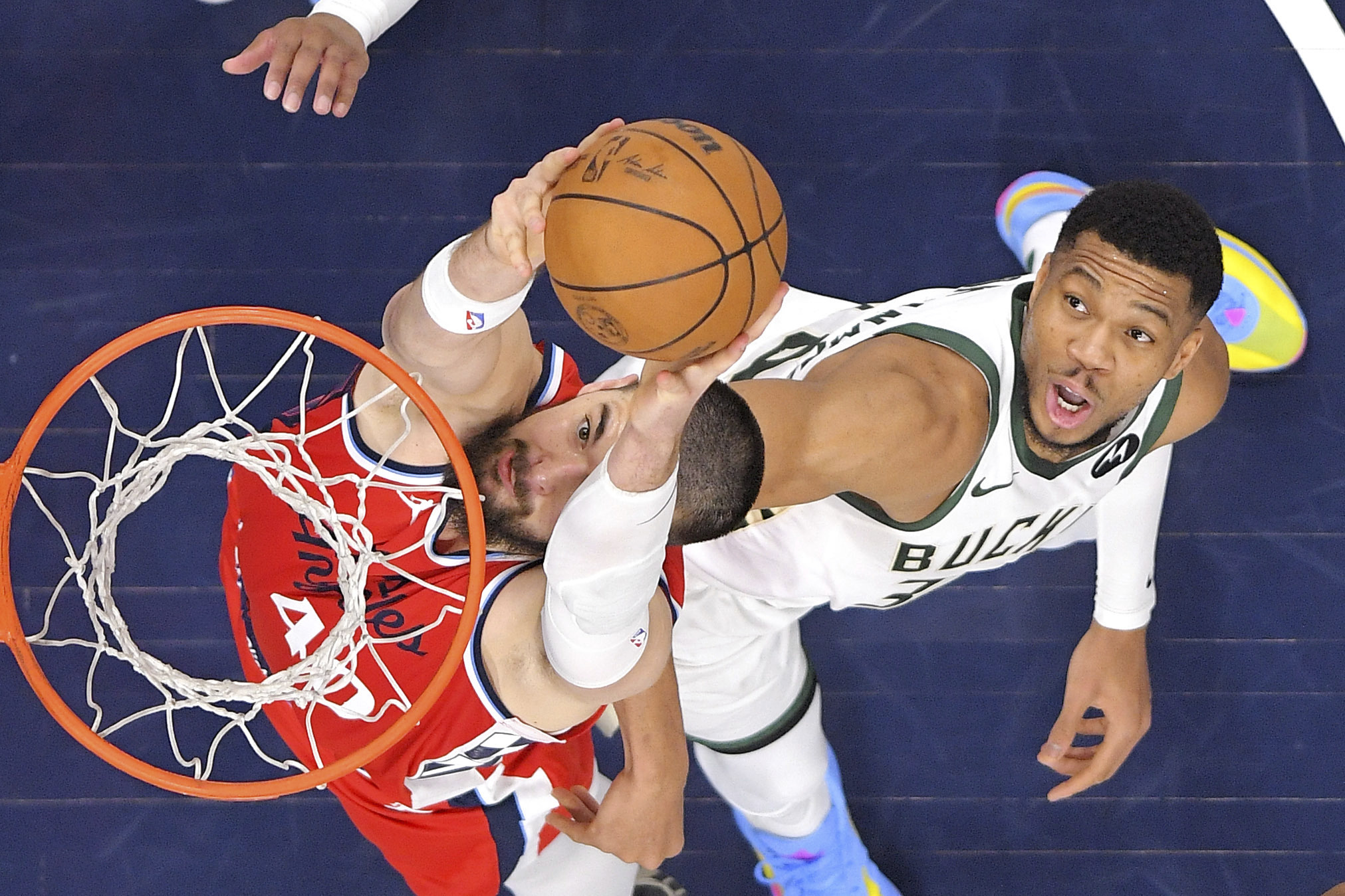 Los Angeles Clippers center Ivica Zubac, left, dunks as Milwaukee Bucks forward Giannis Antetokounmpo defends during the first half of an NBA basketball game, Saturday, Jan. 25, 2025, in Inglewood, Calif.