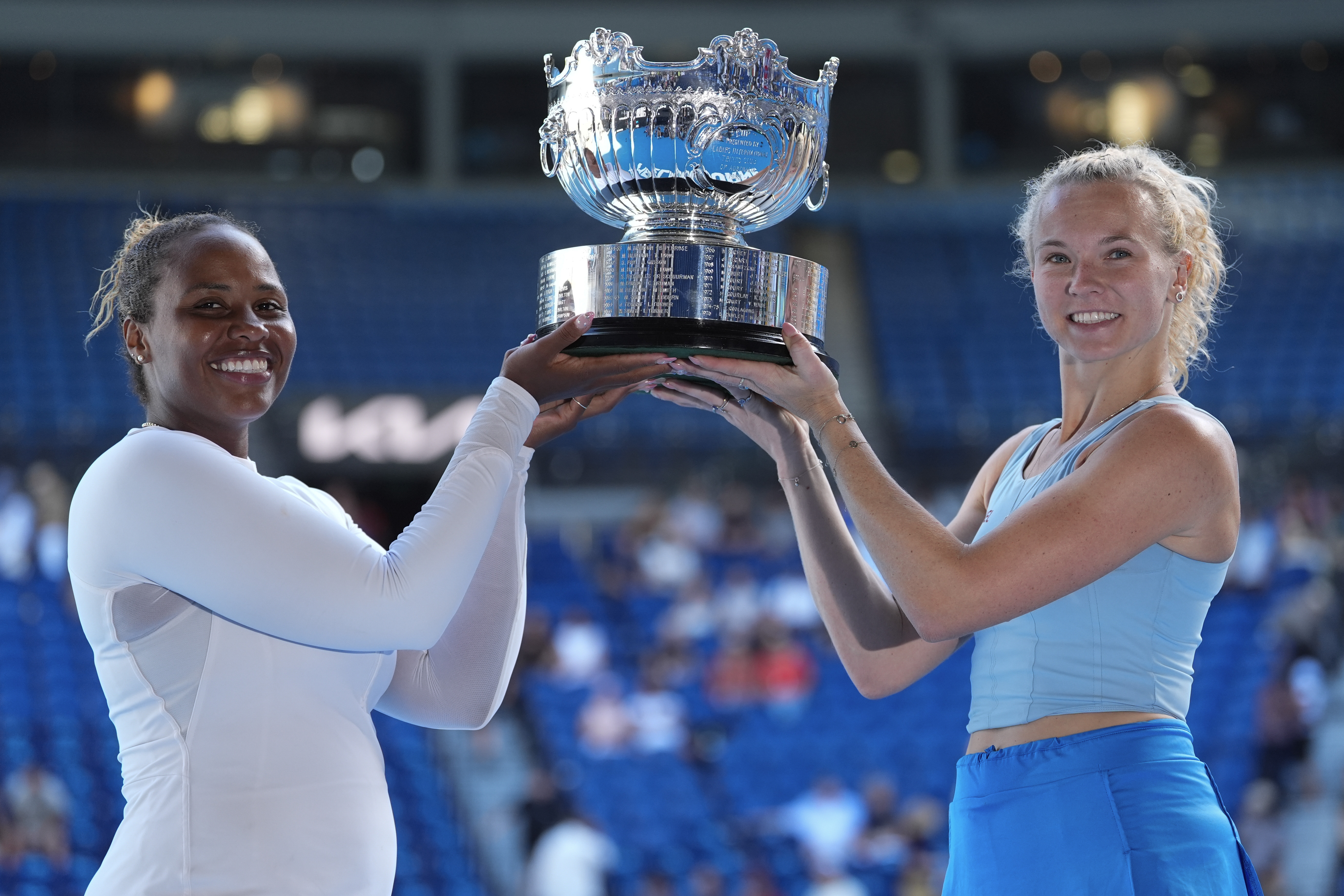 Katerina Sinikova, right, of the Czech Republic and Taylor Townsend of the U.S. hold their trophy aloft after defeating Hsieh Su-Wei of Taiwan and Jelena Ostapenko of Latvia in the women's doubles final at the Australian Open tennis championship in Melbourne, Australia, Sunday, Jan. 26, 2025.