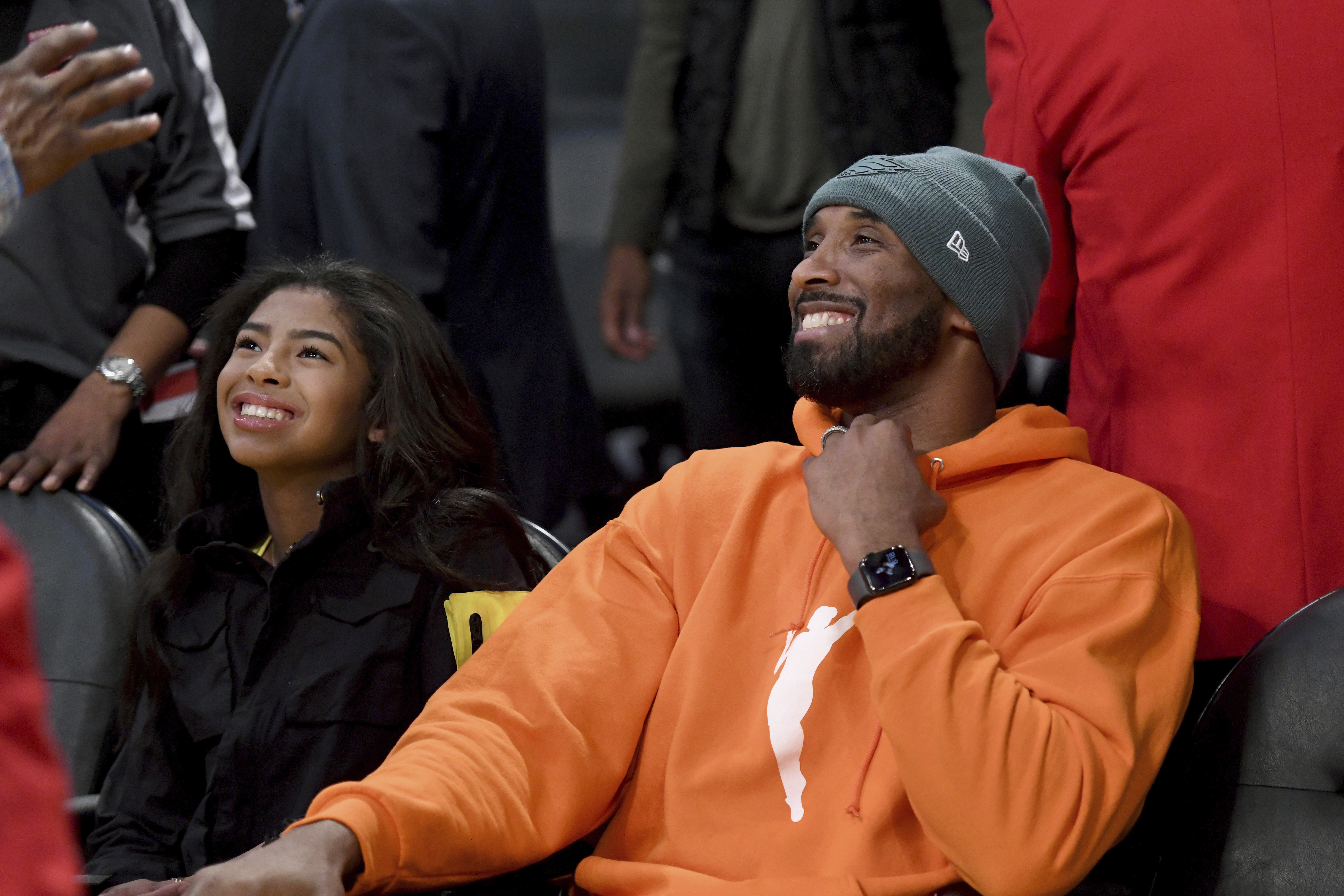 FILE - Former Los Angeles Laker Kobe Bryant and his daughter Gianna Bryant attend an NBA basketball game between the Los Angeles Lakers and Dallas Mavericks Sunday, Dec. 29, 2019, in Los Angeles.