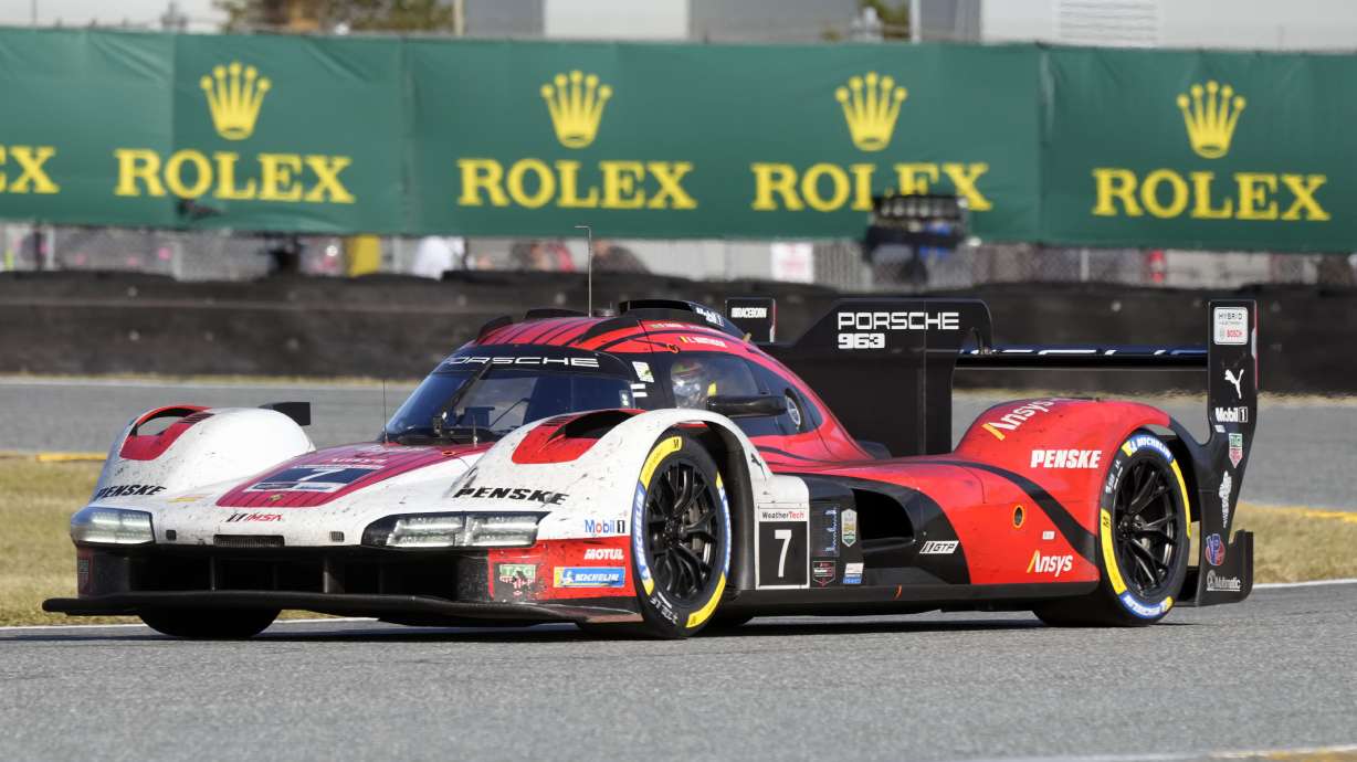 Laurens Vanthoor, of Belgium, comes out of a turn in the Porsche 963 during IMSA Rolex 24 hour auto race at Daytona International Speedway, Sunday, Jan. 26, 2025, in Daytona Beach, Fla.