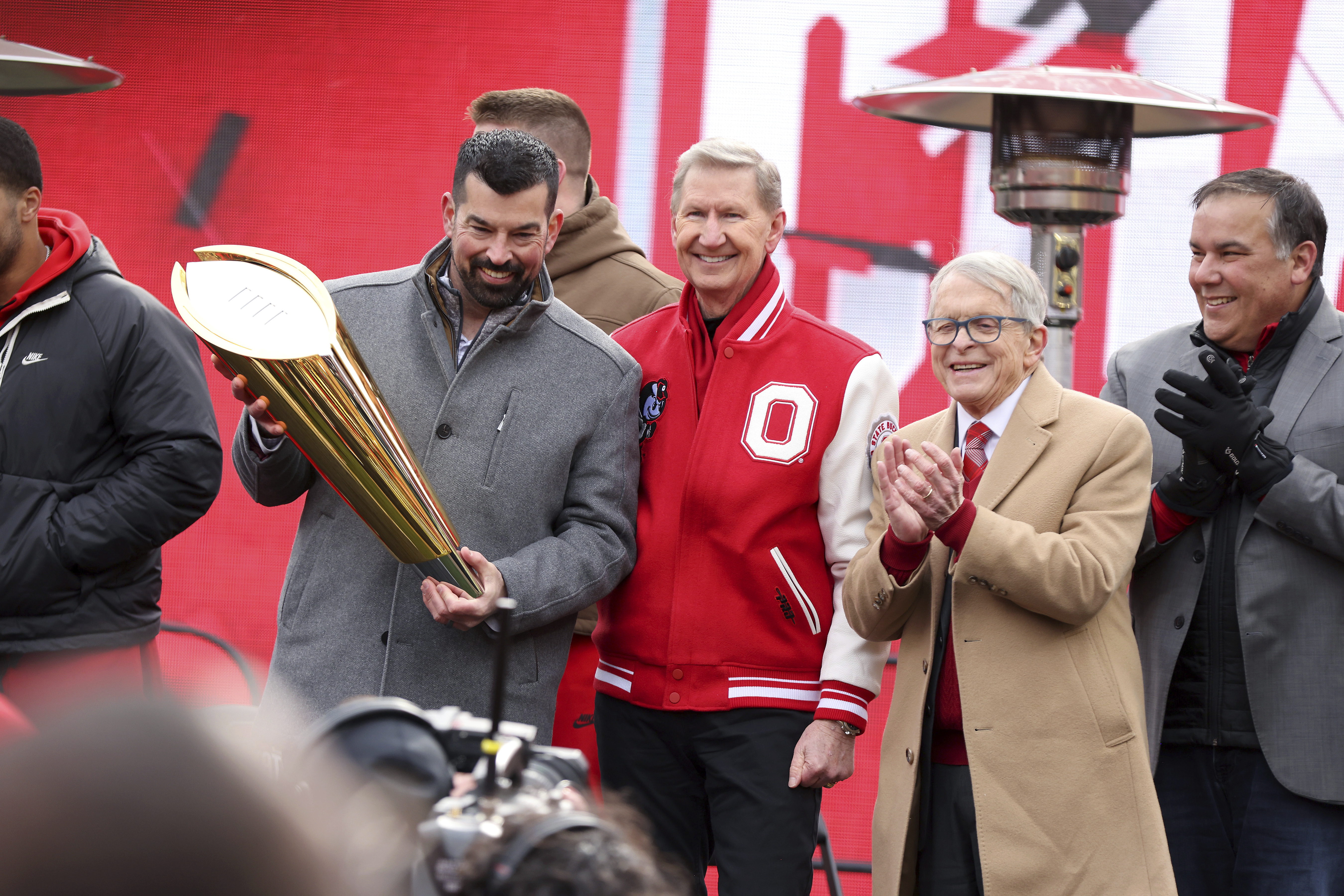 From left, Ohio State head coach Ryan Day poses with Ohio State University president Ted Carter, Ohio Gov. Mike DeWine, and Columbus Mayor Andrew Ginther during the National Championship football celebration at Ohio Stadium in Columbus, Ohio, Sunday, Jan. 26, 2025.