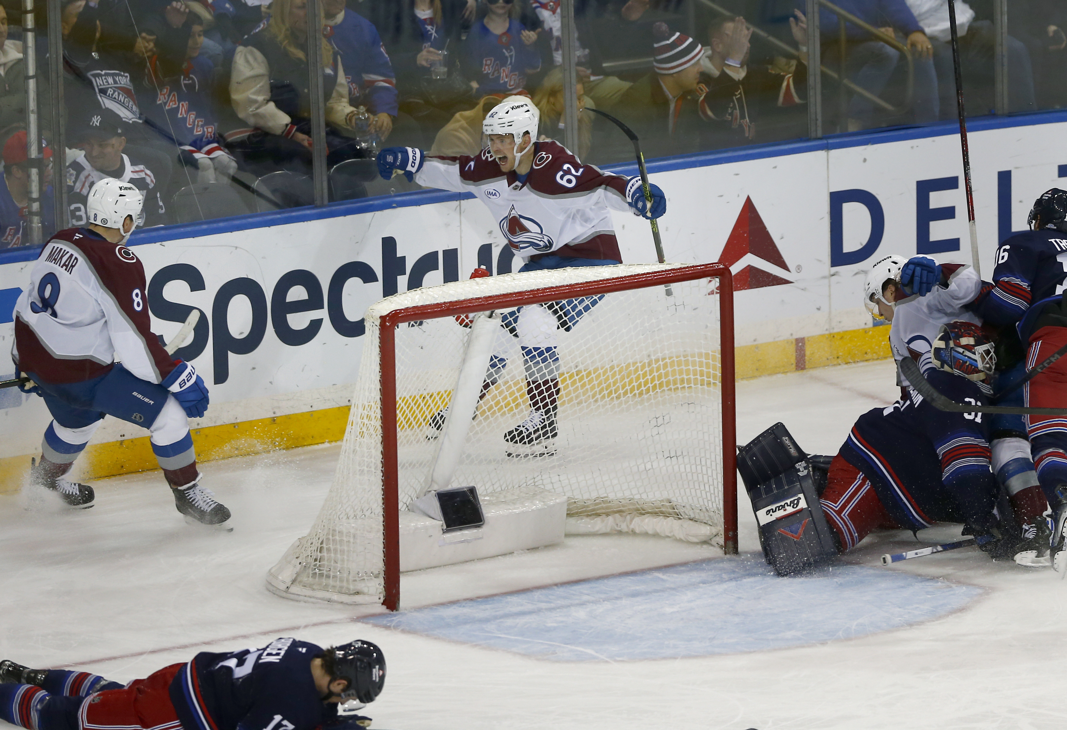 Colorado Avalanche defenseman Cale Makar (8) and forward Artturi Lehkonen (62) celebrate after Lehkonen's winning goal with seconds left in an NHL hockey game against the New York Rangers, Sunday, Jan. 26, 2025, in New York. 