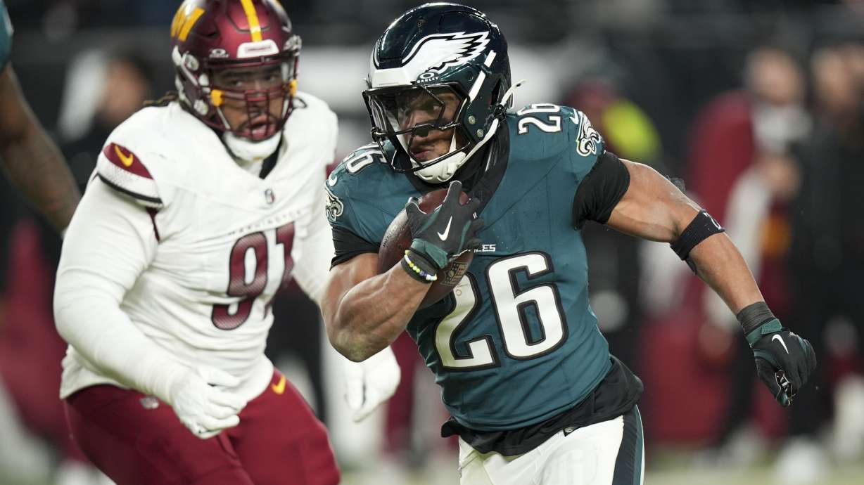 Philadelphia Eagles running back Saquon Barkley runs against the Washington Commanders during the second half of the NFC Championship NFL football game, Sunday, Jan. 26, 2025, in Philadelphia.