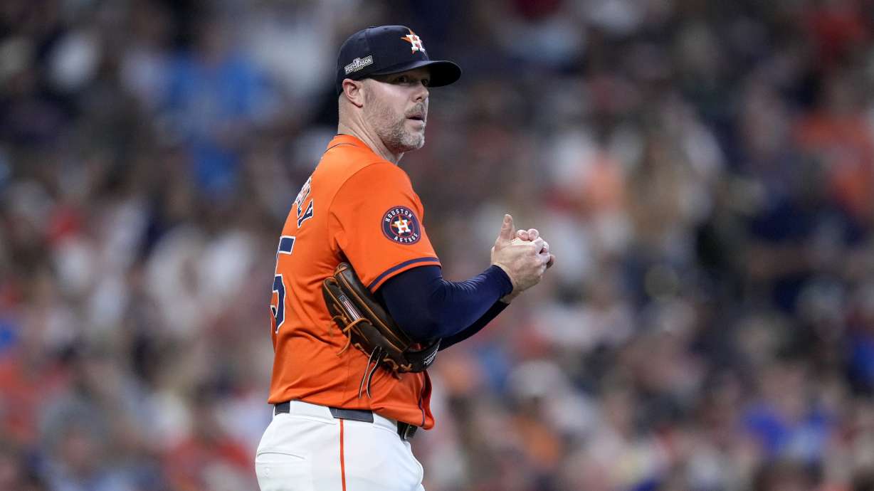 FILE - Houston Astros relief pitcher Ryan Pressly walks back onto the mound after throwing a wild pitch that allowed Detroit Tigers' Kerry Carpenter to score in the eighth inning of Game 2 of an AL Wild Card Series baseball game, Oct. 2, 2024, in Houston.