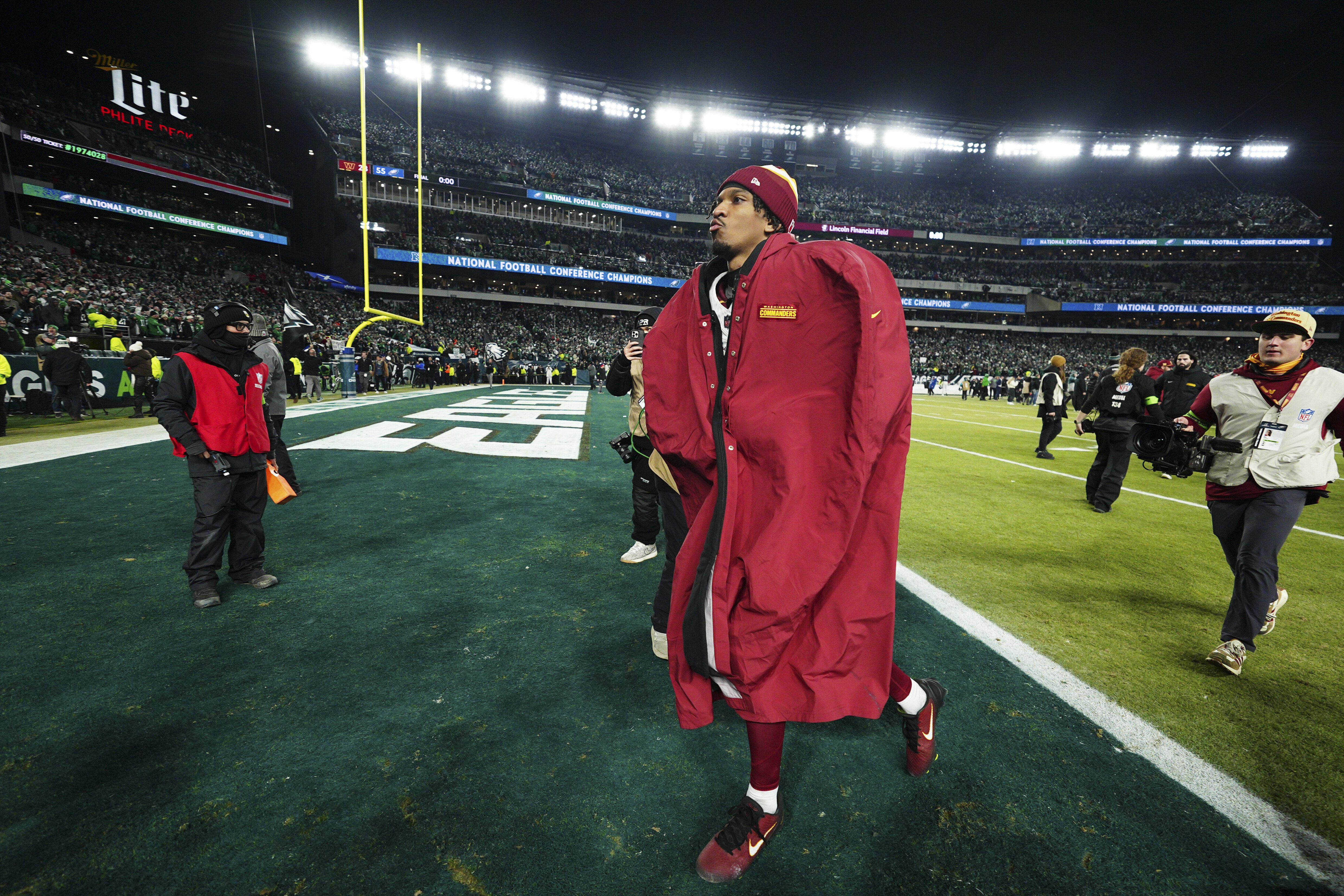 Washington Commanders quarterback Jayden Daniels leaves the field after losing the NFC Championship NFL football game to the Philadelphia Eagles, Sunday, Jan. 26, 2025, in Philadelphia. 