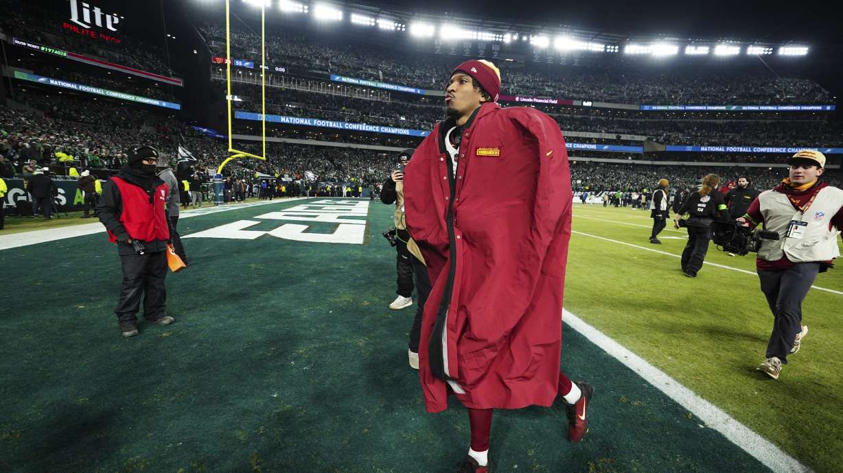 Washington Commanders quarterback Jayden Daniels leaves the field after losing the NFC Championship NFL football game to the Philadelphia Eagles, Sunday, Jan. 26, 2025, in Philadelphia.